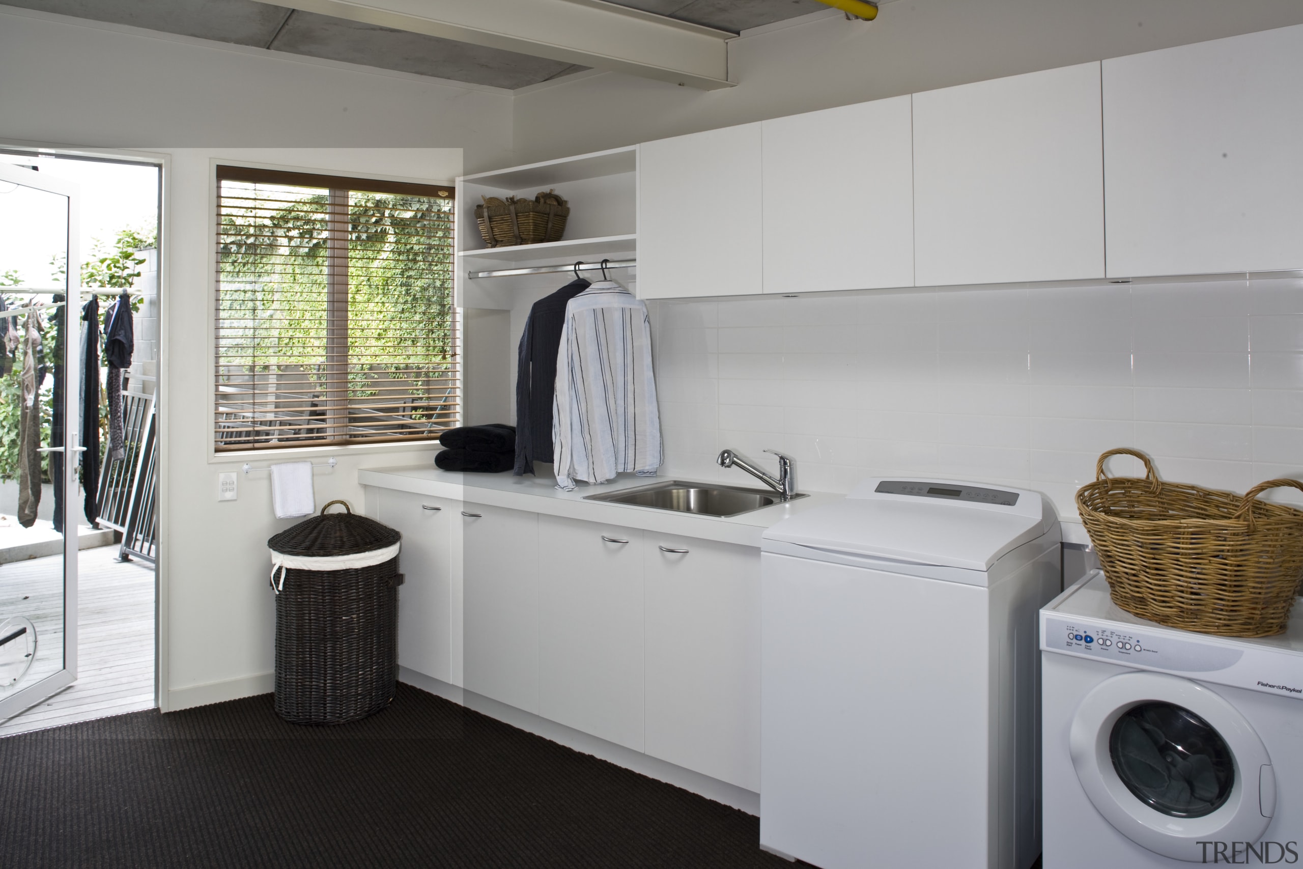 View of a laundry which was added to kitchen, laundry, laundry room, real estate, room, gray