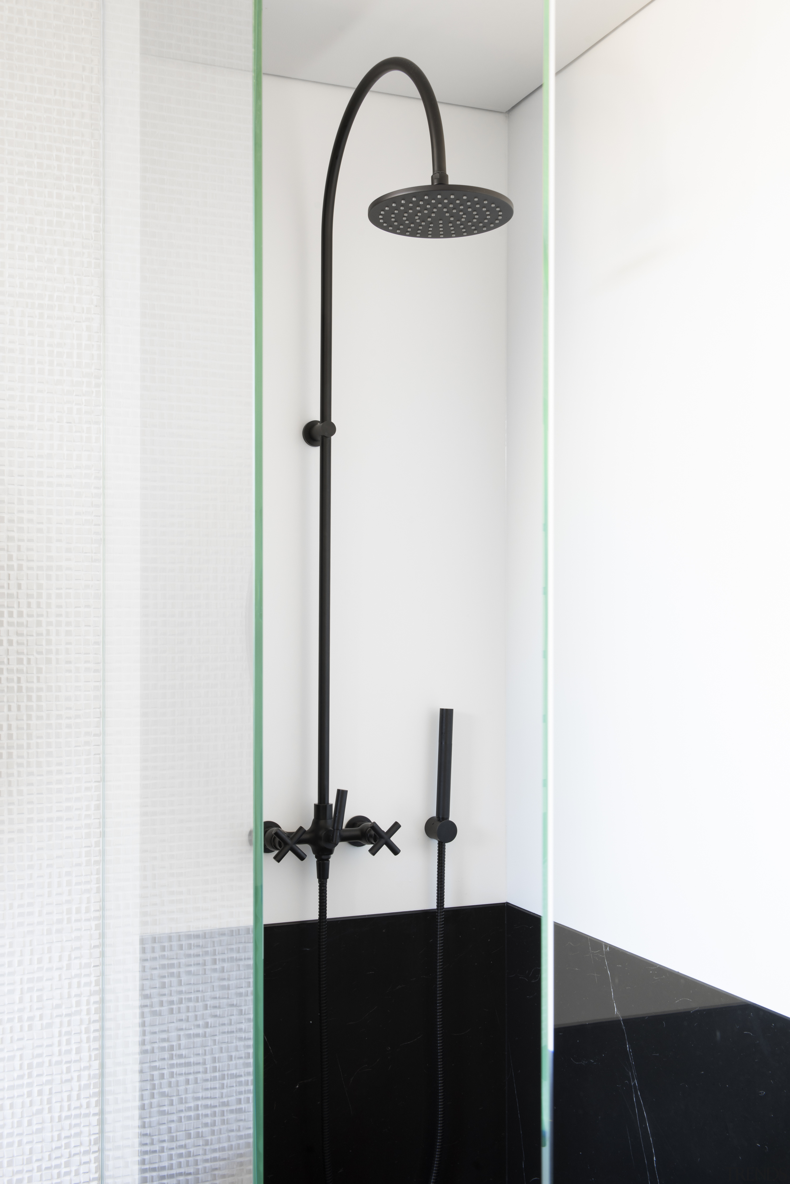 ​​​​​​​This contemporary bathroom’s black and white theme continues architecture, bathroom, shower, shower panel, white, black fittings, Minosa, Darren Genner