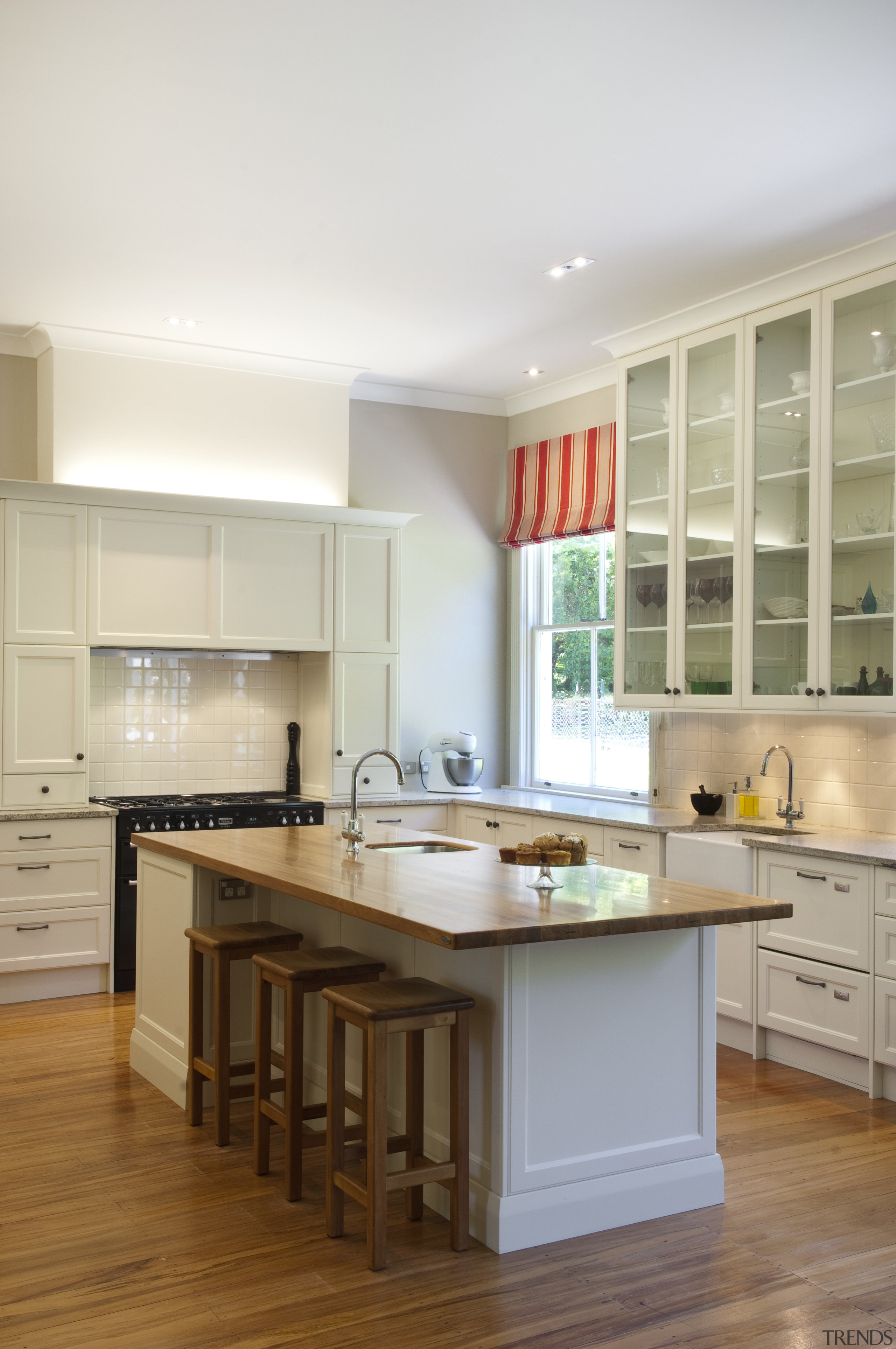 View of contemporary kitchen with wooden flooring and cabinetry, countertop, cuisine classique, floor, hardwood, interior design, kitchen, room, wood flooring, white, brown