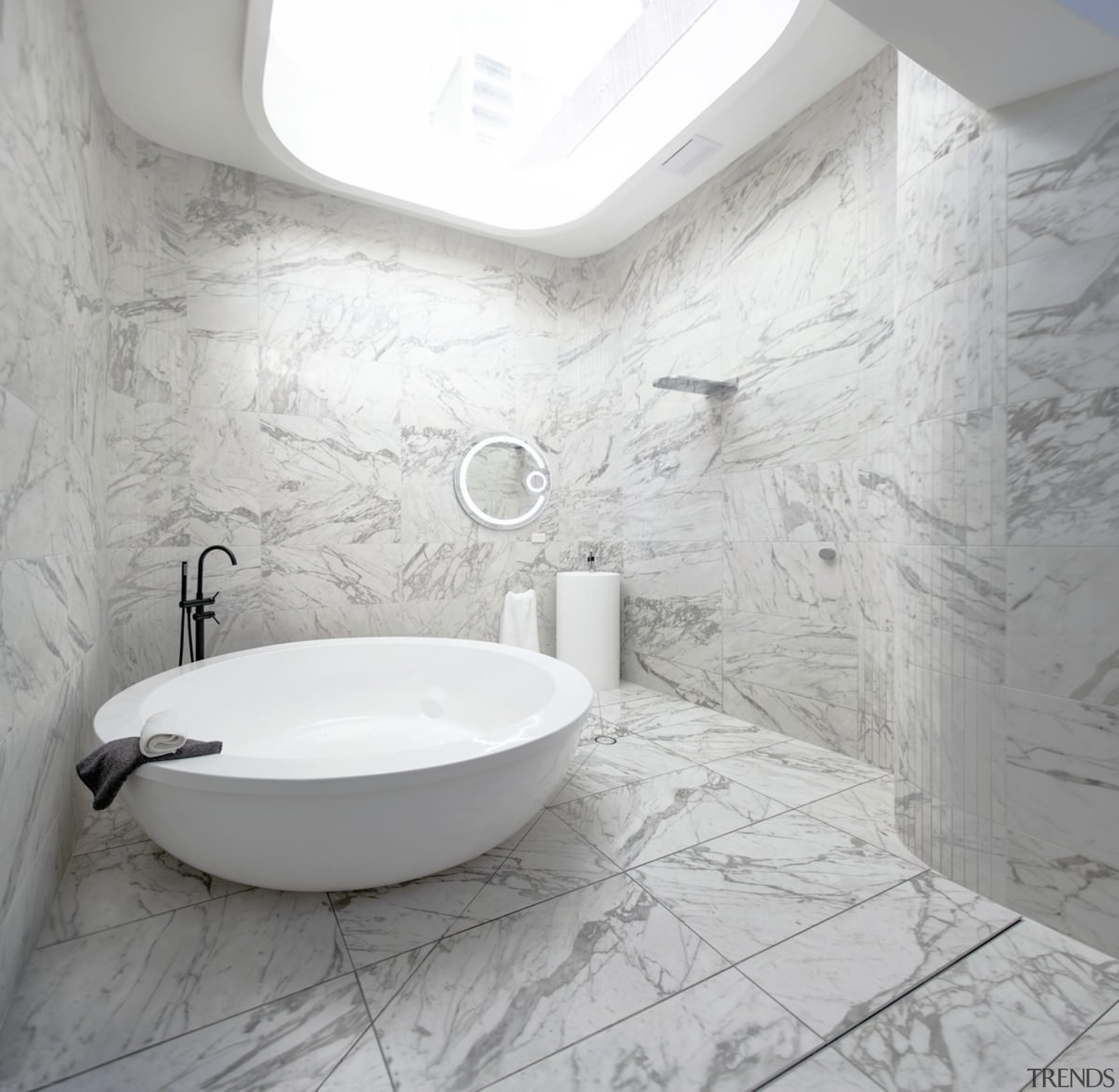 Marble runs across the floor – and up bathroom, bathroom sink, bidet, ceramic, floor, flooring, interior design, plumbing fixture, product design, room, sink, tap, tile, toilet seat, wall, gray, white