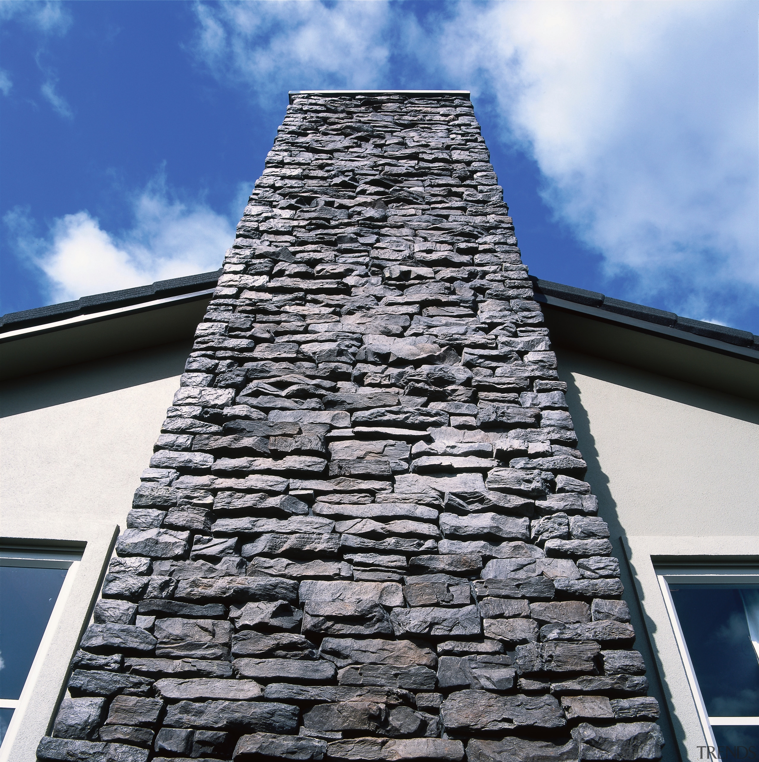 View of the stonework by Stutex Stone - building, chimney, roof, sky, wall, white, black, blue