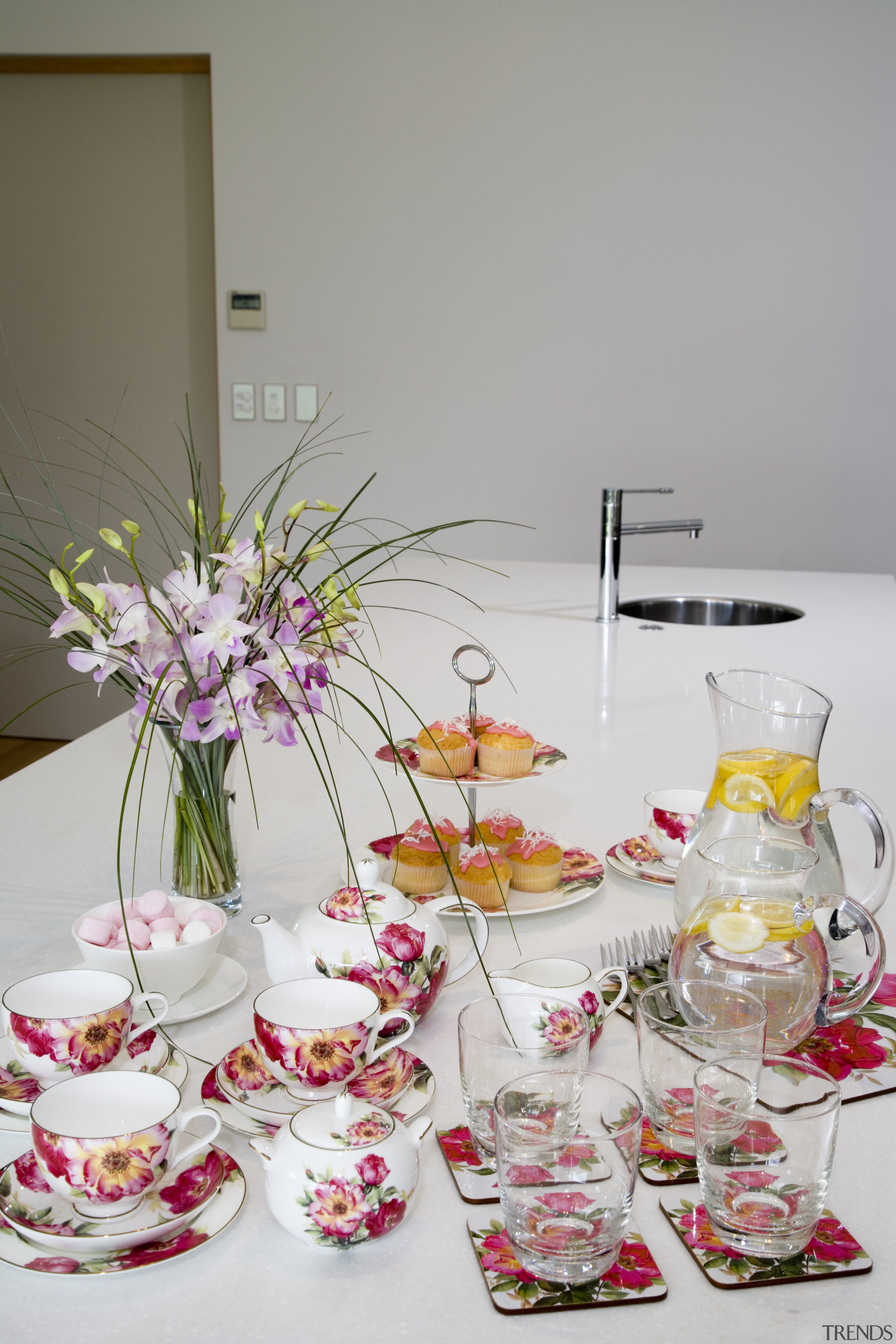 A view of these quality coffee mugs, crockery centrepiece, drinkware, floral design, floristry, flower, flower arranging, petal, pink, porcelain, stemware, table, tableware, vase, gray