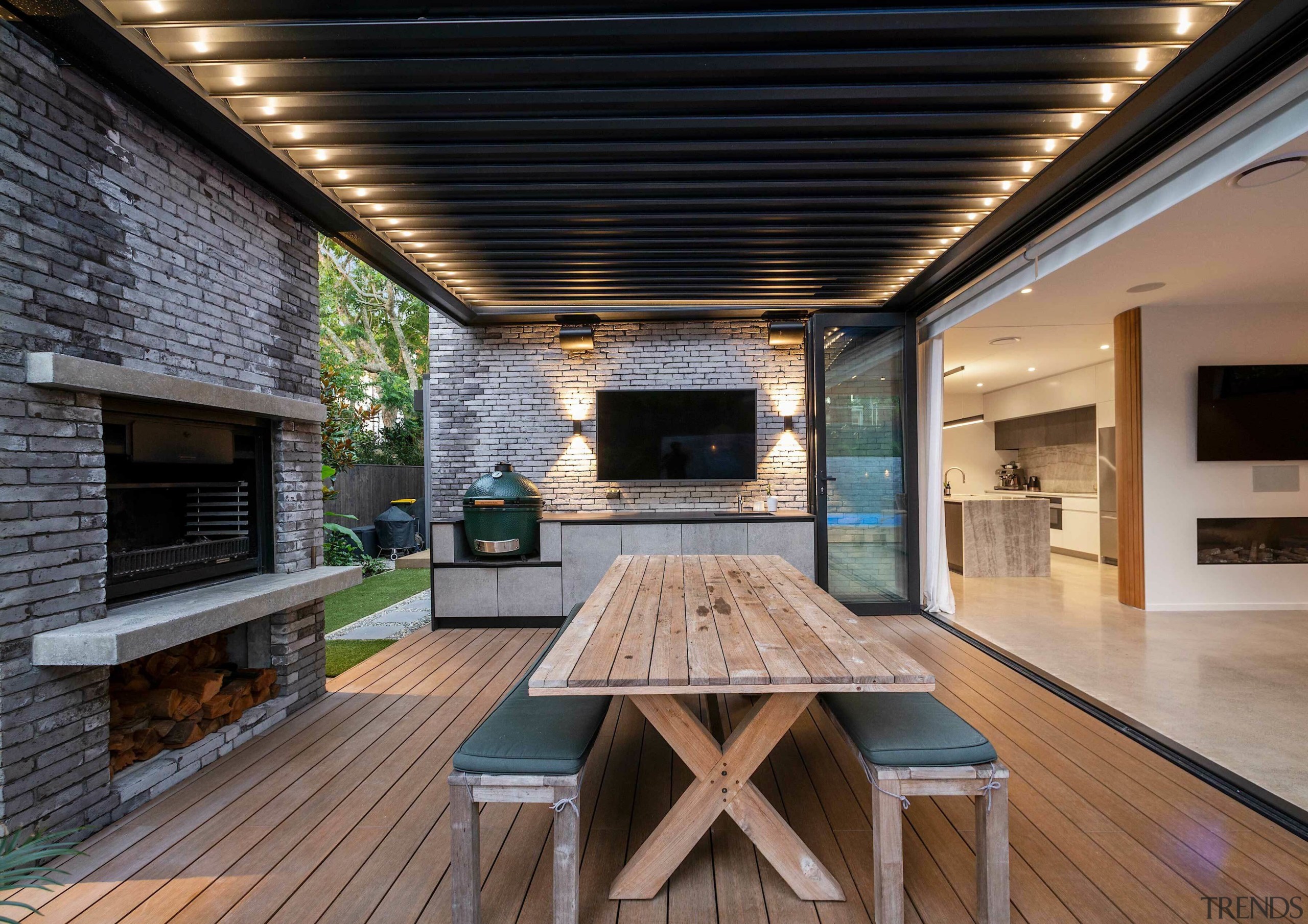 The outdoor room has a louvre roof, catering 