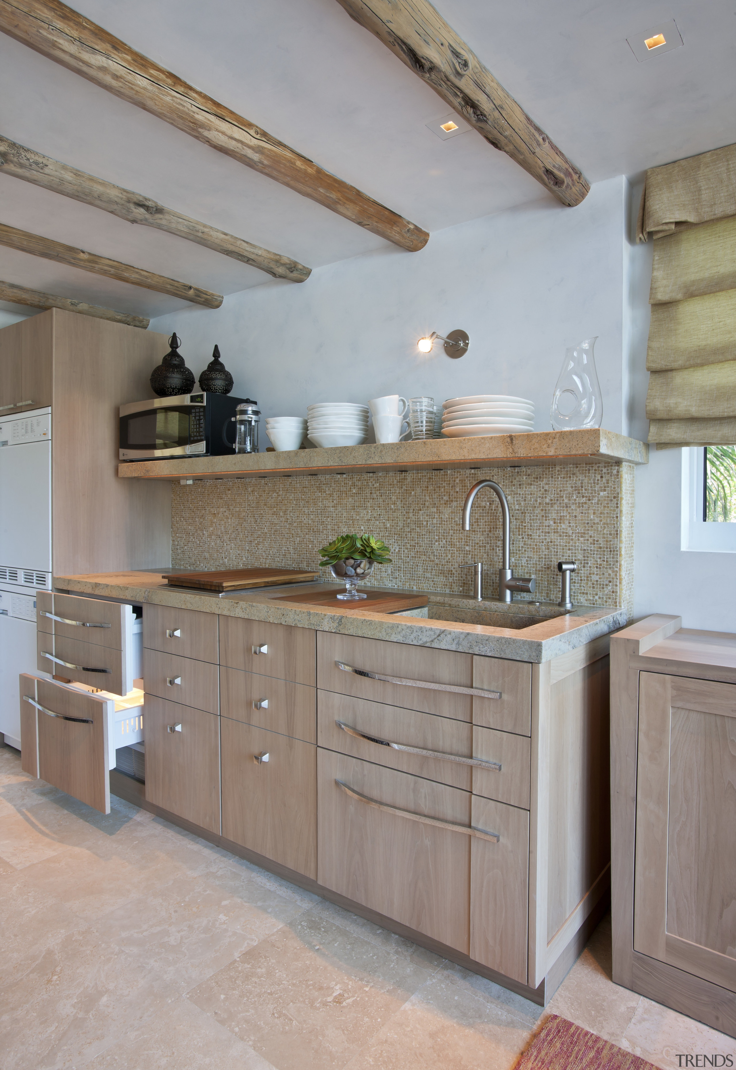 This homes' kitchen was designed by Mick De cabinetry, countertop, cuisine classique, floor, flooring, hardwood, home, interior design, kitchen, room, wall, wood, wood flooring, gray