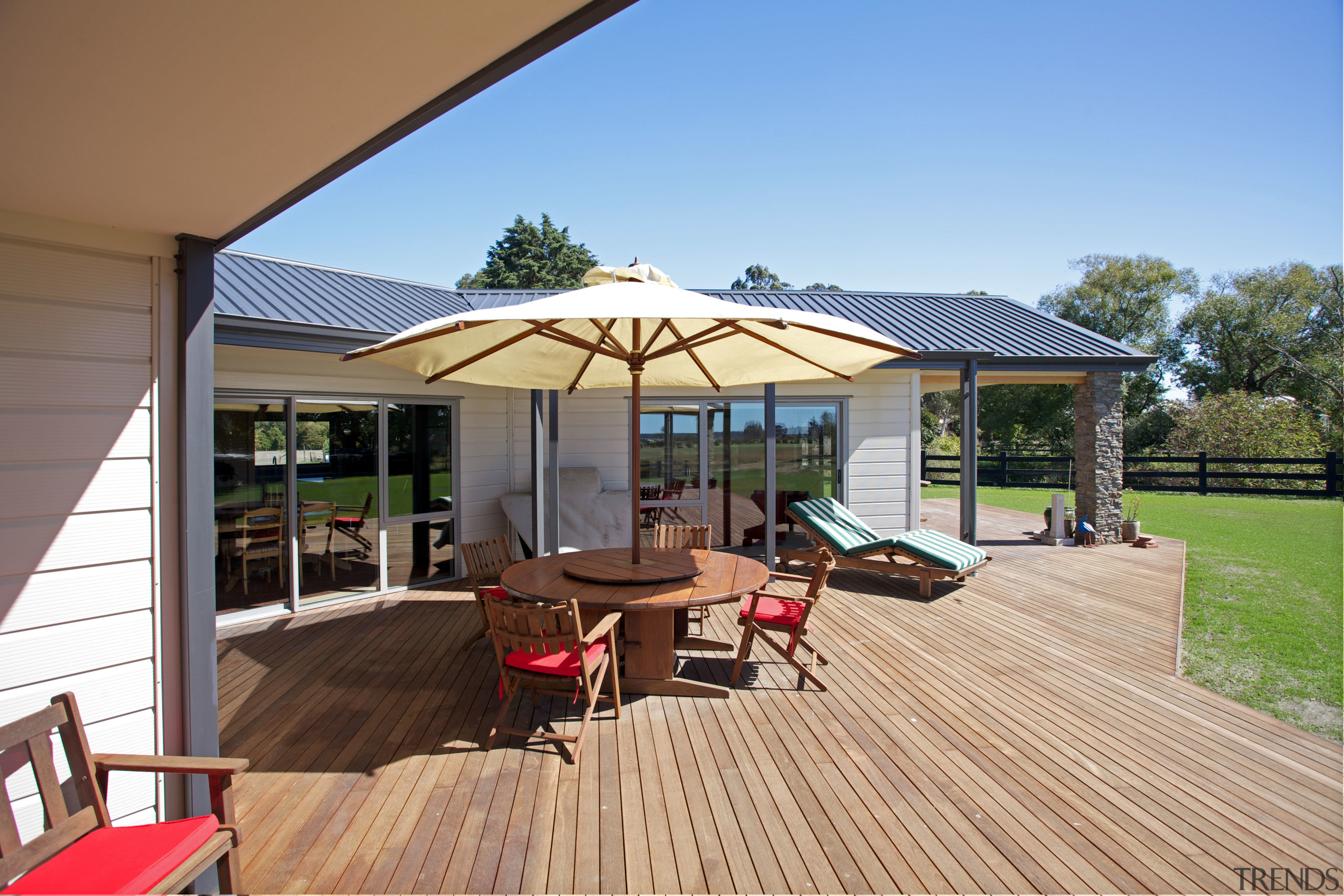 This new Lockwood, built by Lockwood Canterbury, is deck, home, house, outdoor structure, patio, property, real estate, roof, shade