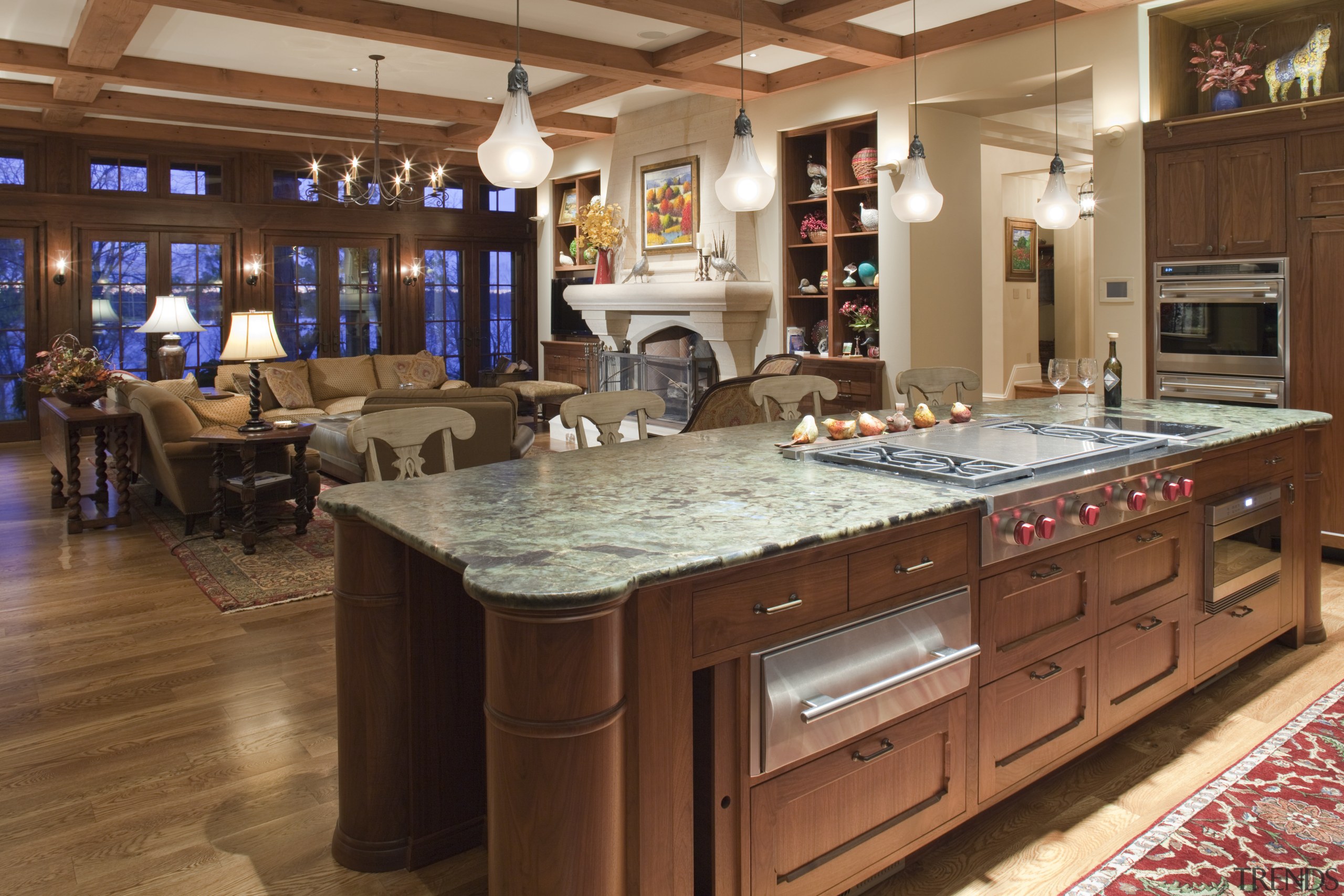 View of kitchen island with drawers. - View countertop, flooring, interior design, kitchen, room, brown