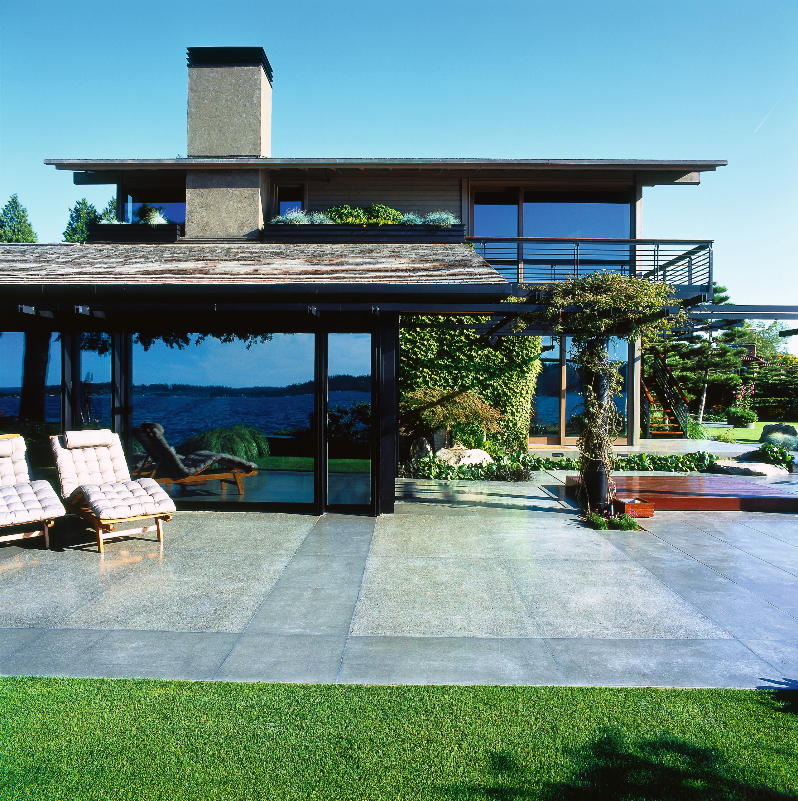 View of the back patio - View of house, outdoor structure, real estate, roof, teal