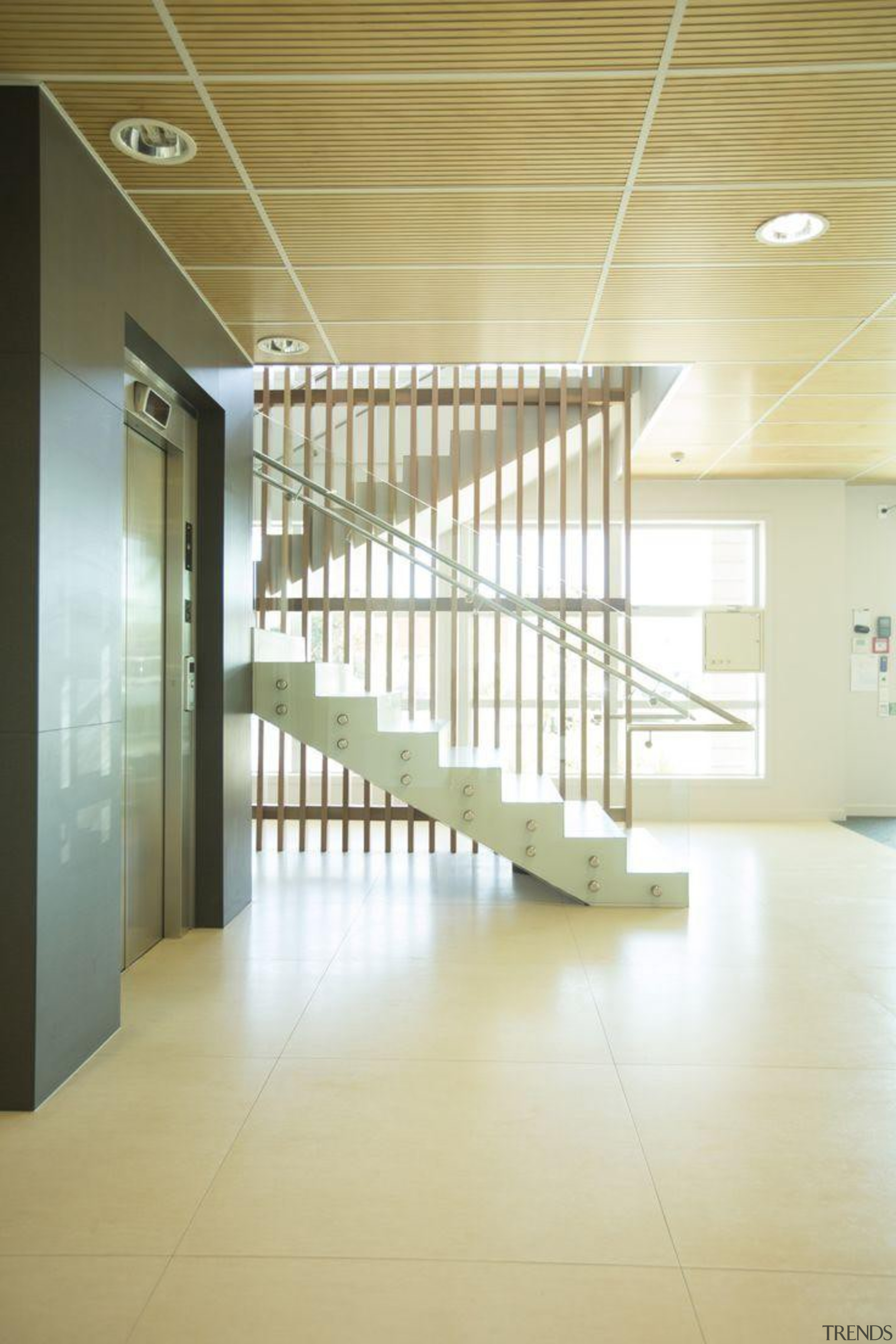 Wall featuring Naturali basalto vena scura and Floor architecture, ceiling, daylighting, floor, flooring, glass, handrail, interior design, lobby, stairs, structure, yellow