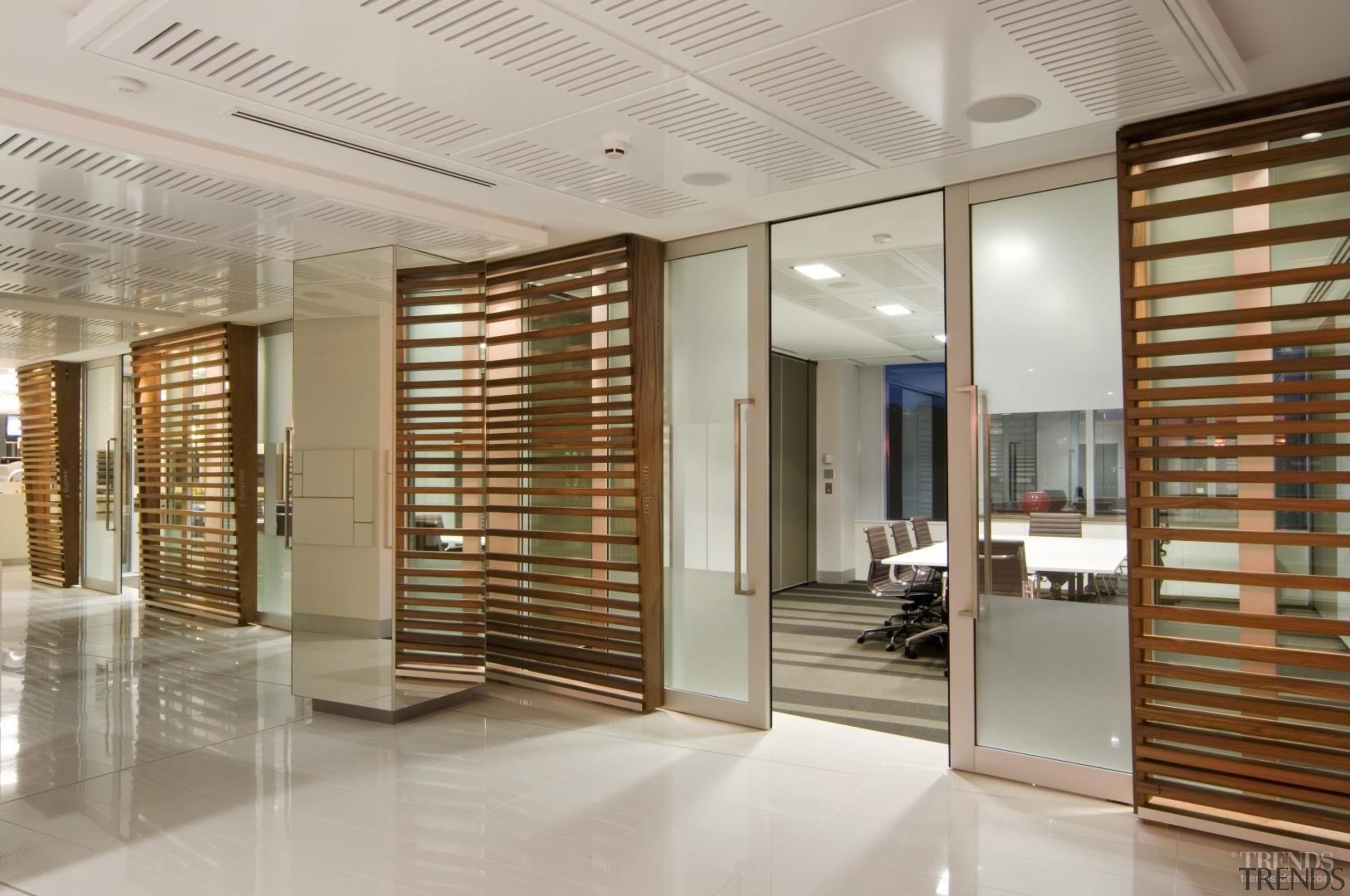 Below The office has an open-plan design to ceiling, floor, flooring, interior design, lobby, real estate, window covering, gray, brown