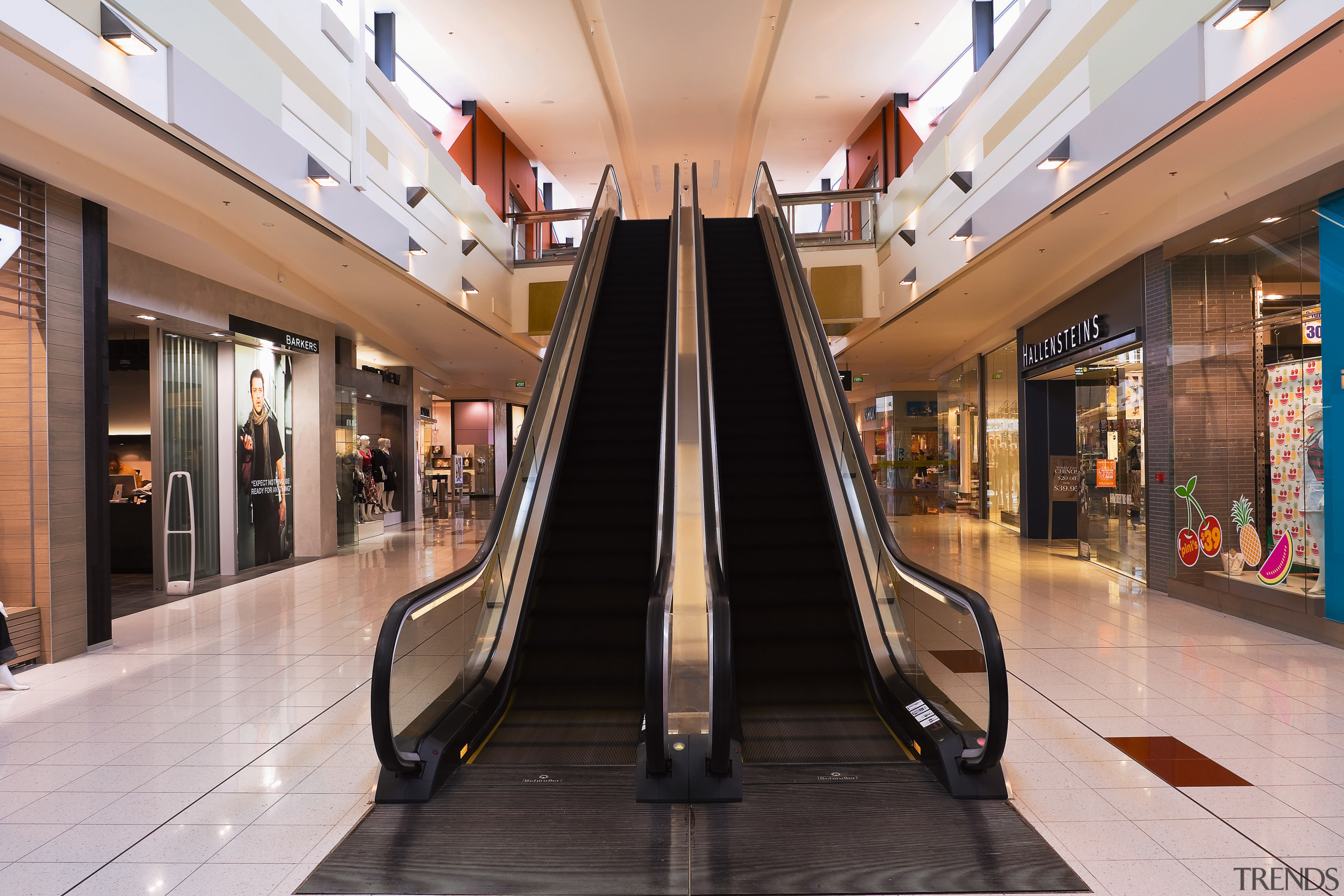 A view of a mechanical feature in Sylvia building, escalator, interior design, lobby, outlet store, retail, shopping, shopping mall, gray, black
