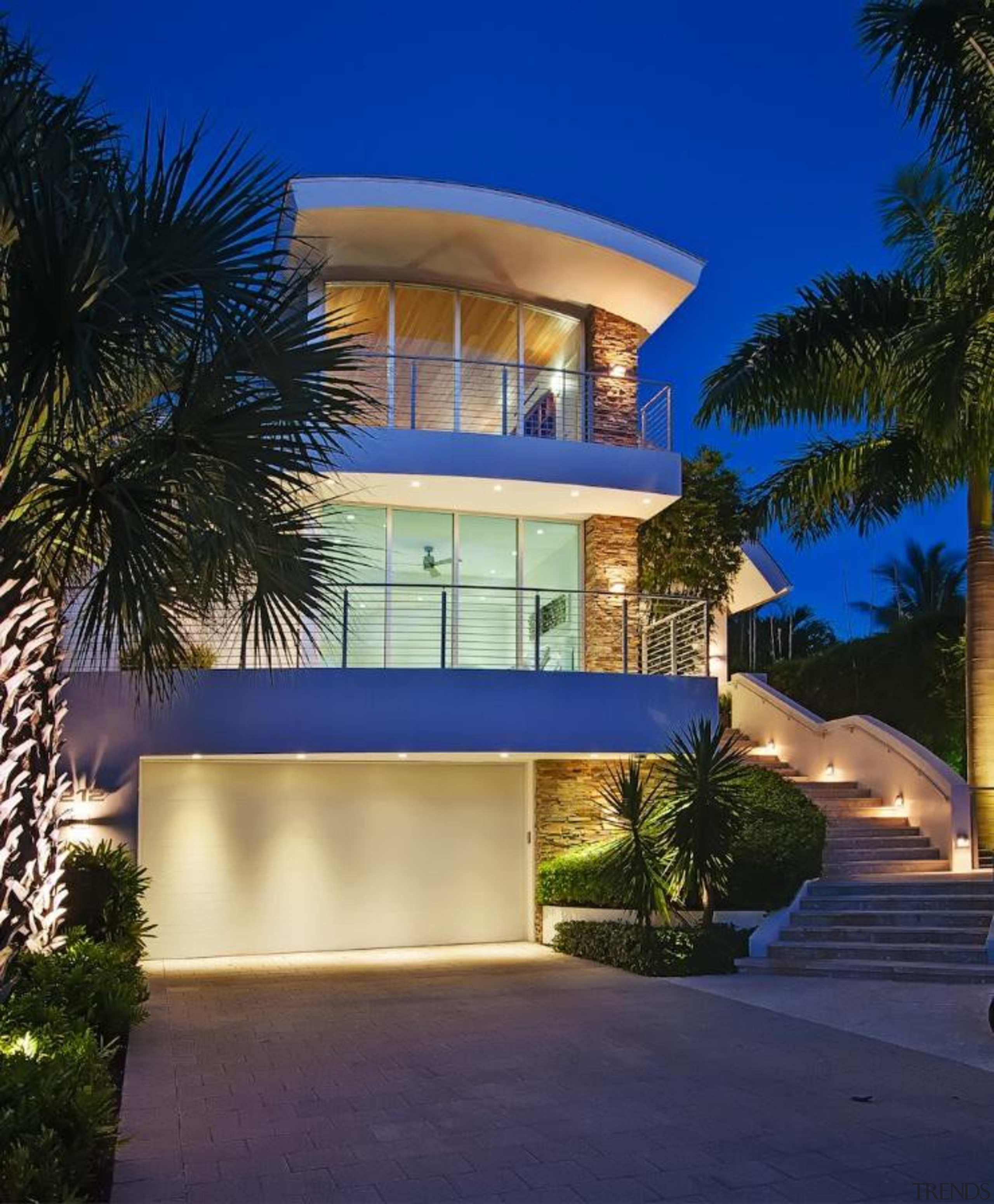 The Hink residence in Fort Lauderdale is a apartment, architecture, arecales, building, condominium, estate, facade, hacienda, home, hotel, house, landscape lighting, lighting, majorelle blue, mansion, palm tree, property, real estate, residential area, resort, sky, villa, blue