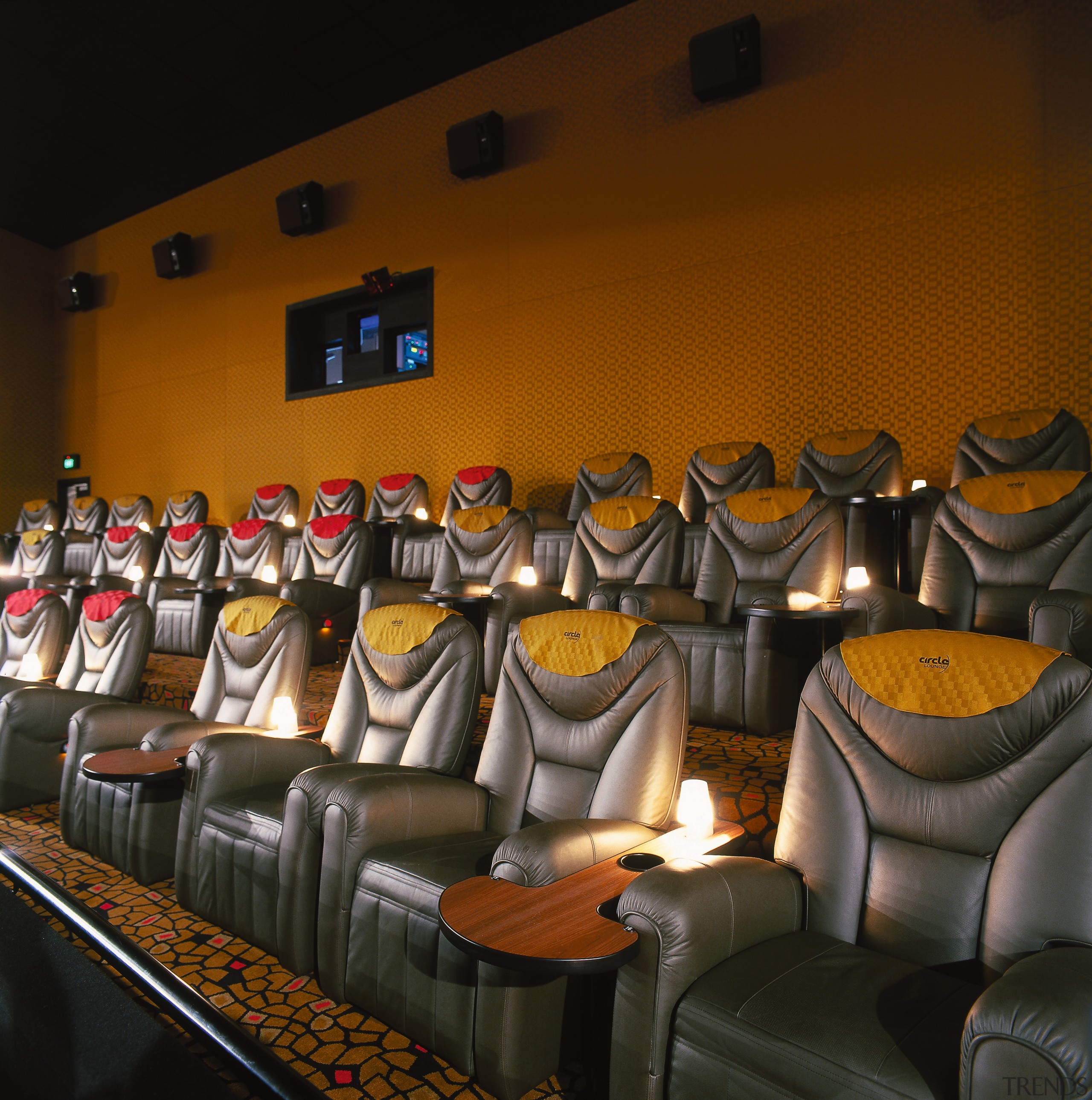 View of armchairs in cinema with projector room black, brown