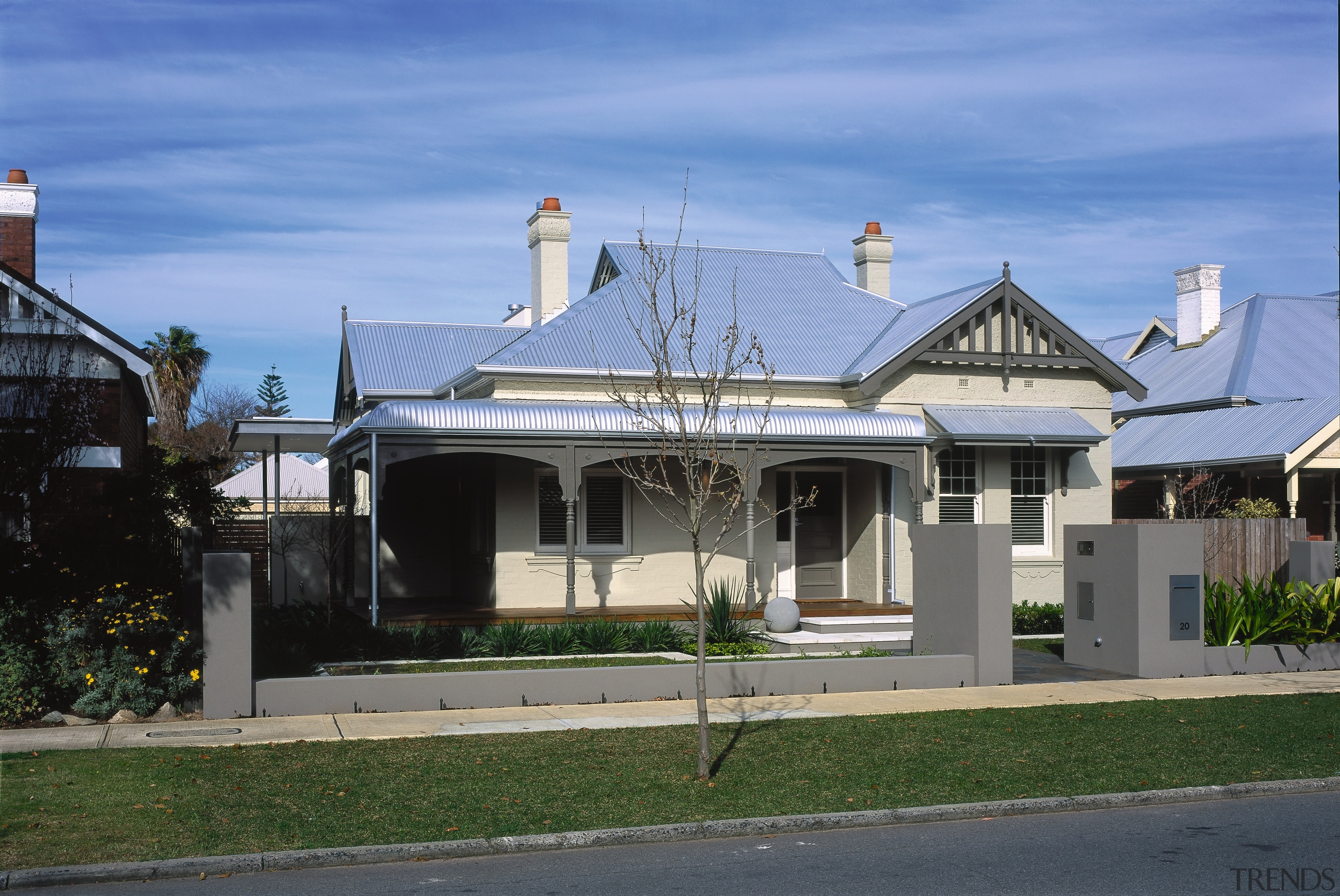 Exterior view of home and front veranda. - architecture, building, cottage, estate, facade, home, house, mansion, neighbourhood, property, real estate, residential area, roof, sky, suburb, teal