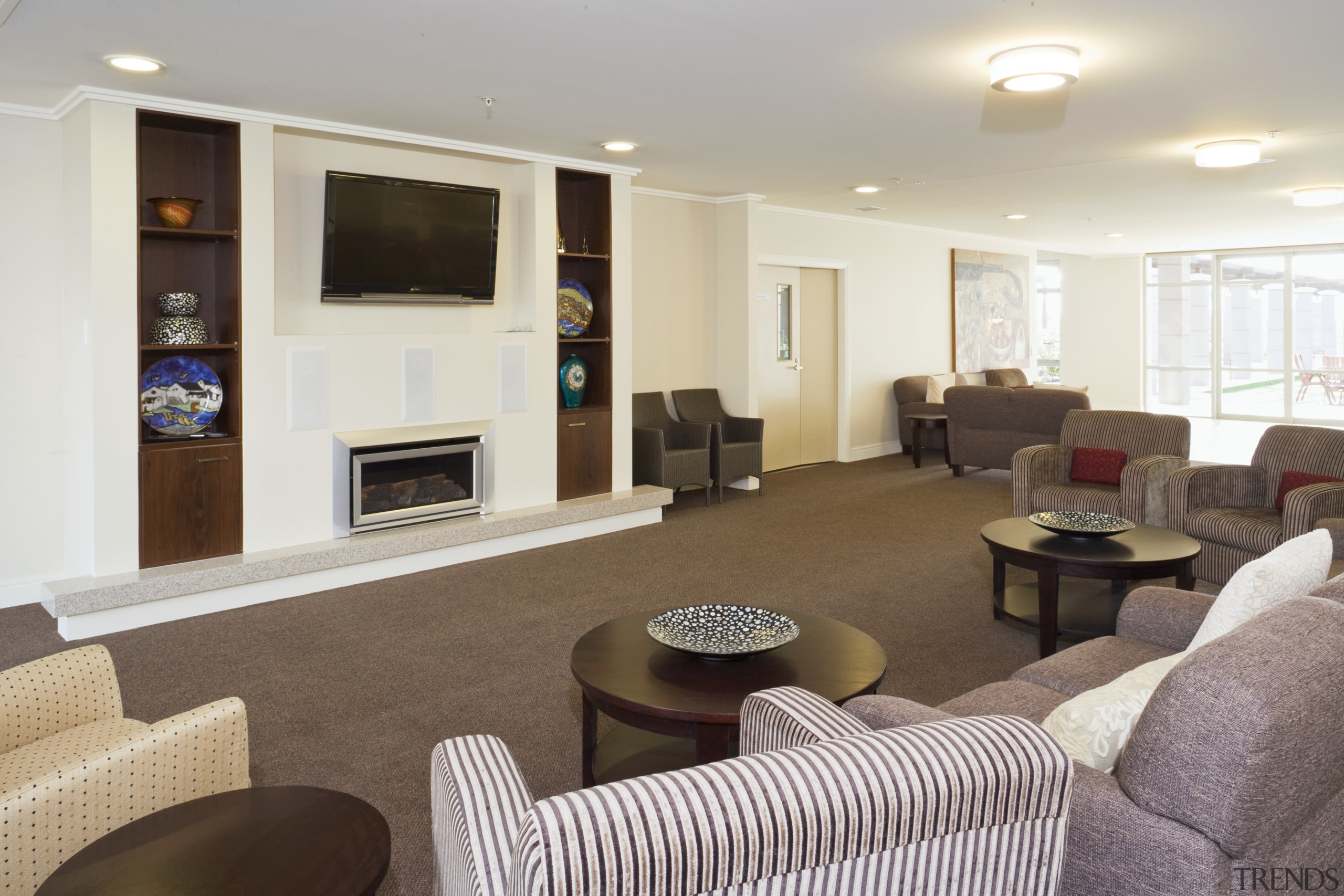 View of a communal lounge area with couches interior design, living room, lobby, property, real estate, room, gray, brown