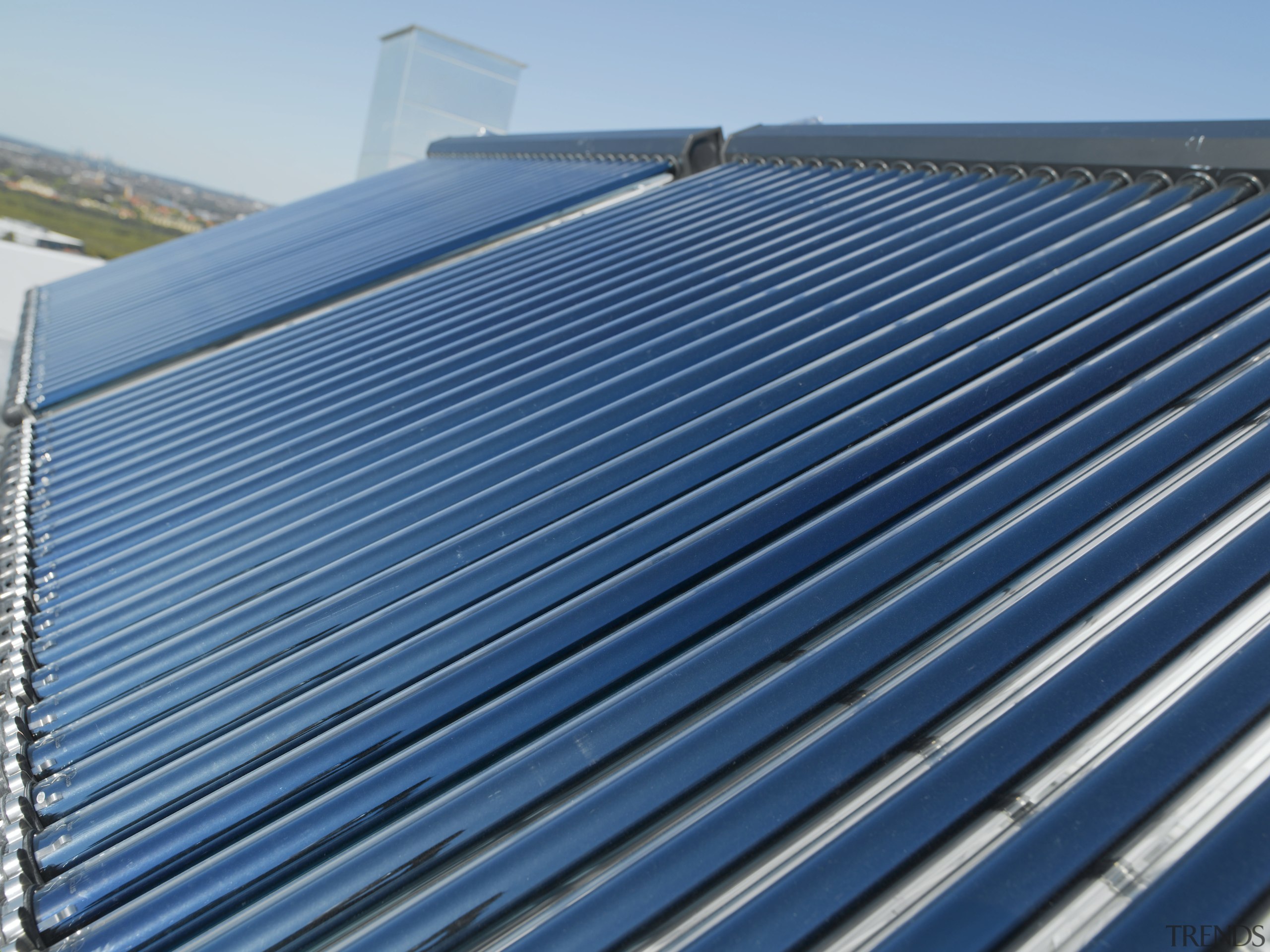 Exterior view of the Pullman hotel where the daylighting, energy, line, metal, roof, sky, solar energy, steel, structure, teal, blue