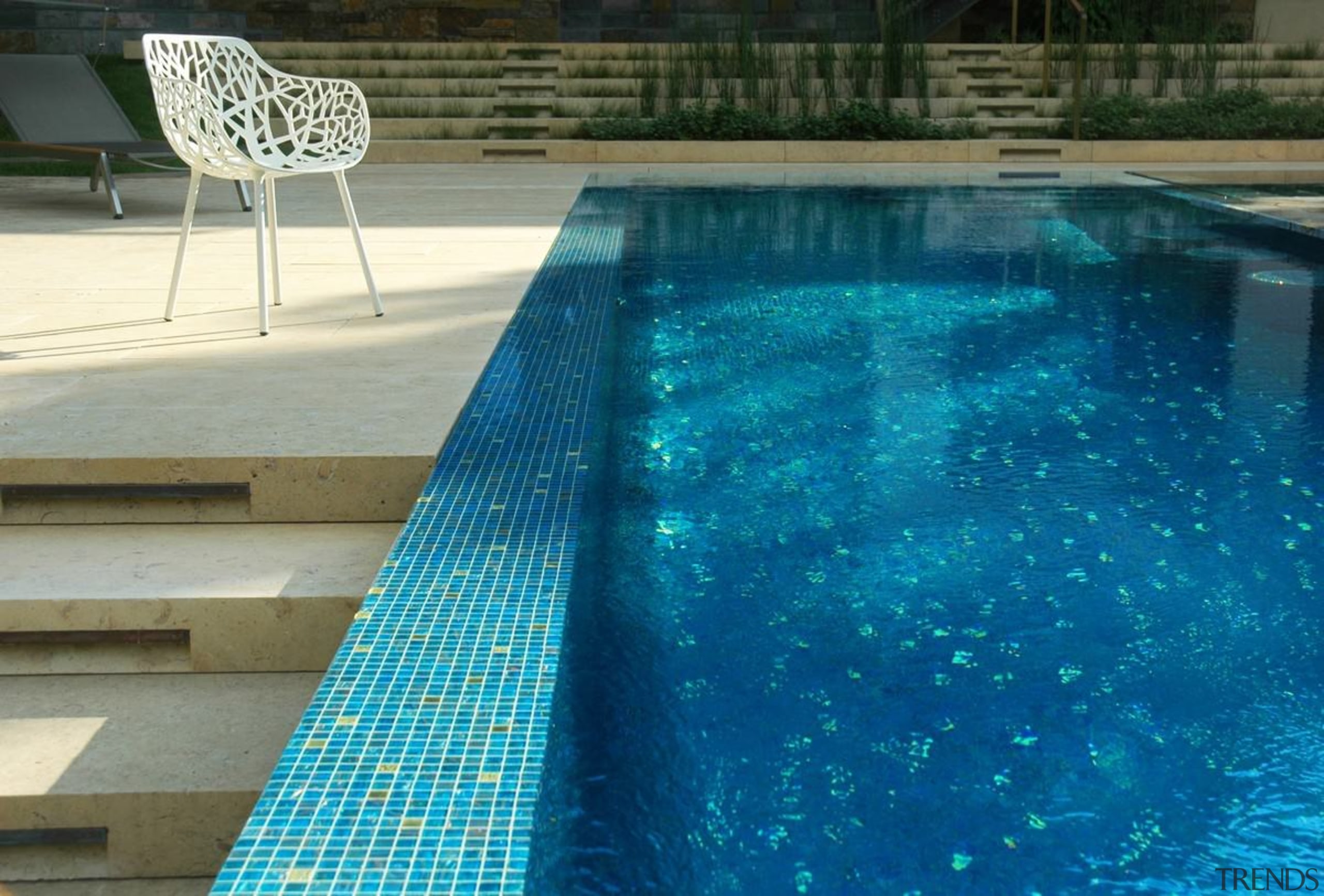 A classic blue tile mosaic gives this pool aqua, leisure, property, swimming pool, water, water feature, blue