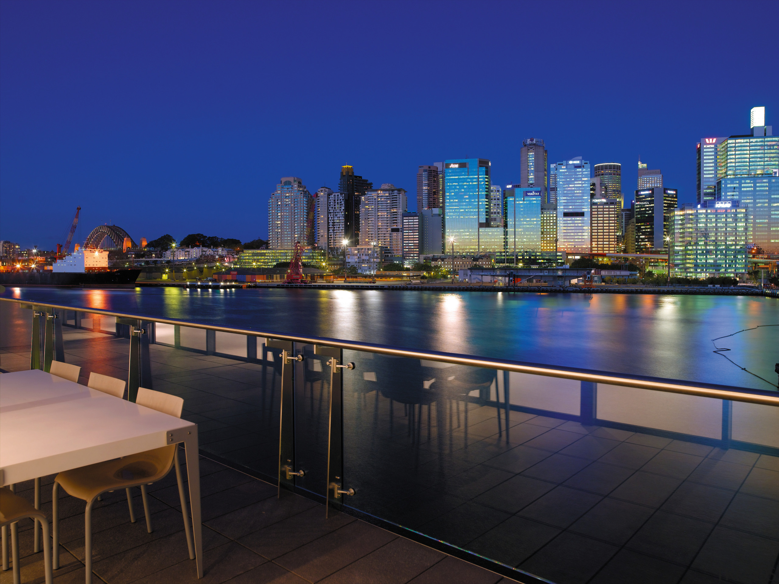 view from the sunders wharf apartments looking at apartment, architecture, city, cityscape, condominium, downtown, dusk, evening, home, lighting, metropolis, metropolitan area, night, real estate, reflection, residential area, roof, sky, skyline, skyscraper, tower block, urban area, water, blue, black