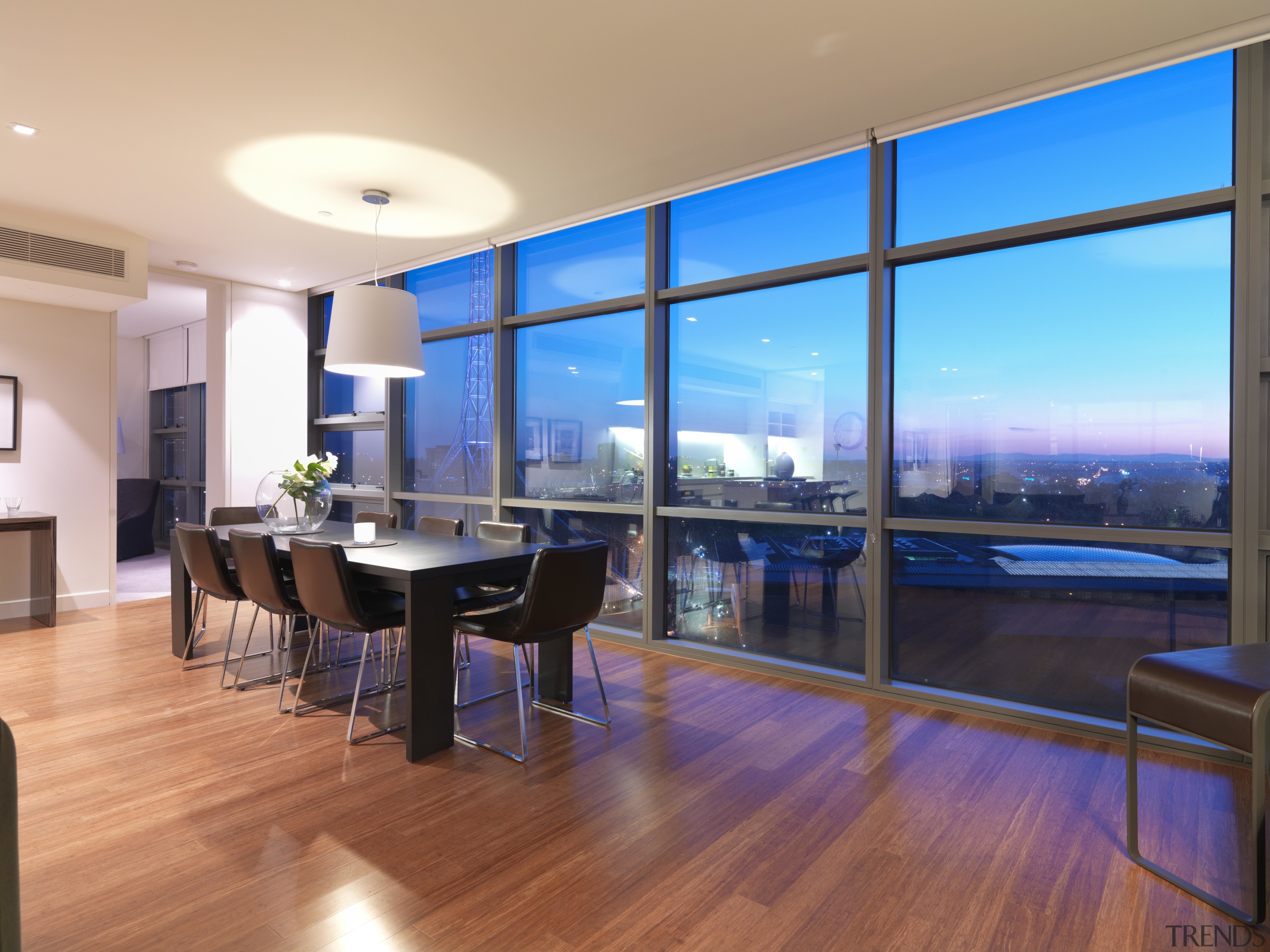 View of the dining area of an apartment apartment, architecture, floor, flooring, hardwood, house, interior design, living room, real estate, room, table, window, wood, wood flooring