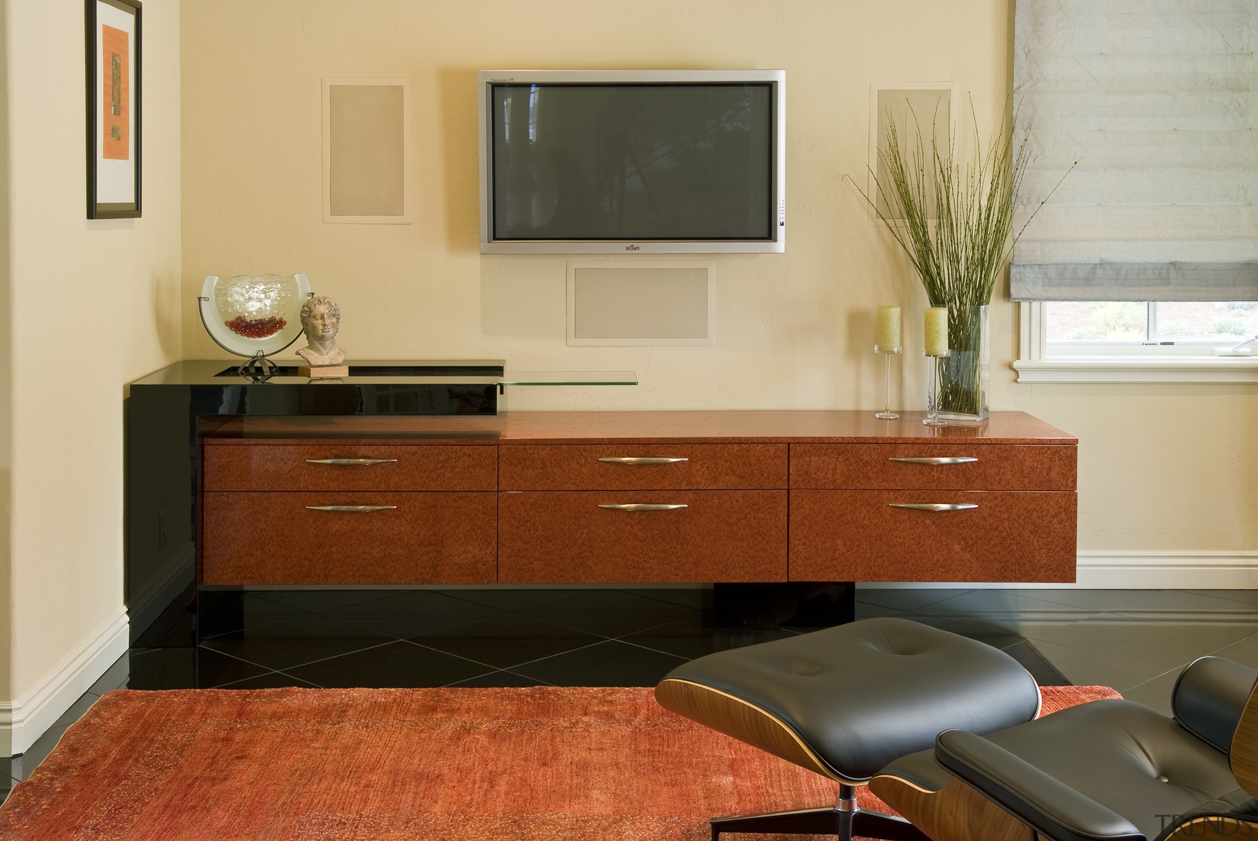 The owners of this kitchen, designed by the cabinetry, chest of drawers, drawer, floor, flooring, furniture, hardwood, home, interior design, kitchen, living room, room, sideboard, table, wall, wood, orange, brown