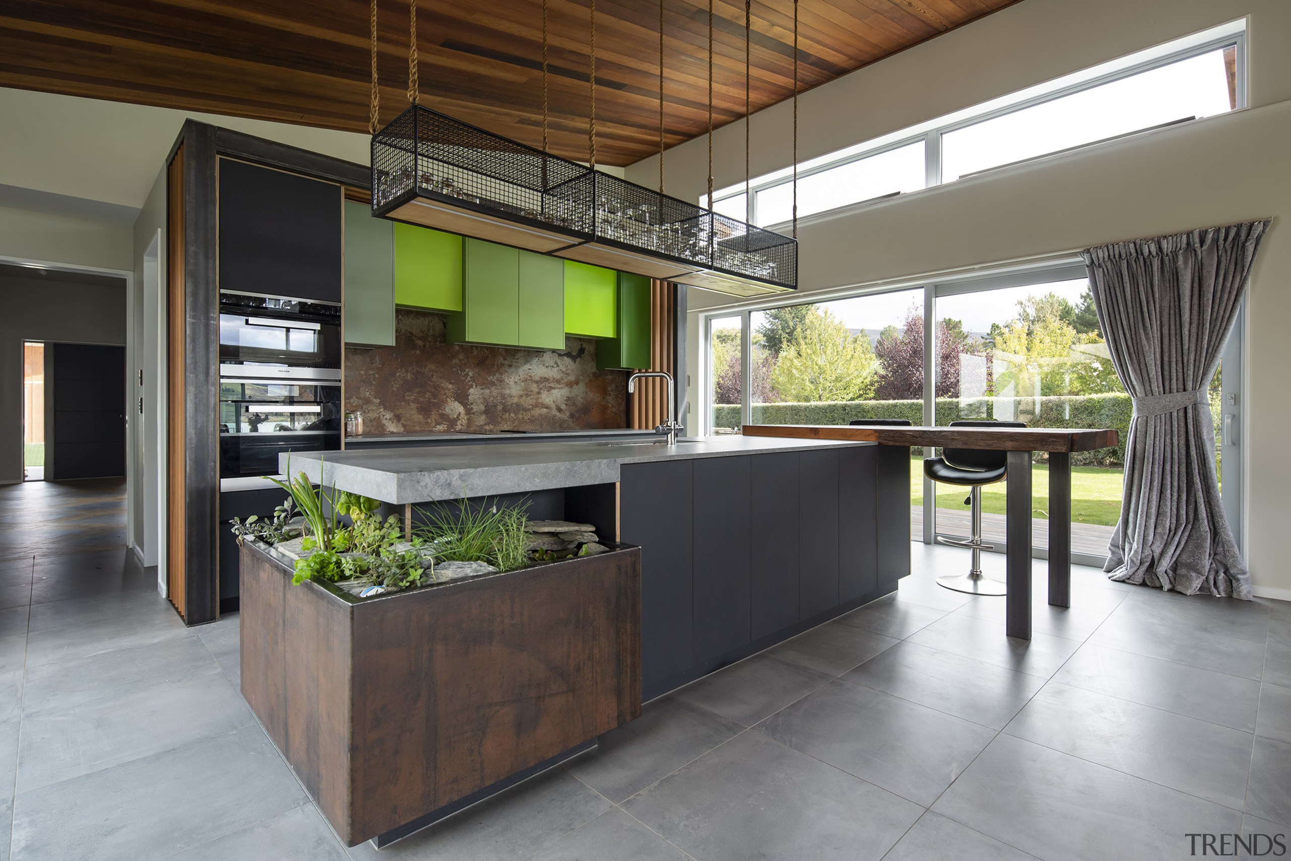 The hanging storage/display mesh-sided shelving above the kitchen 