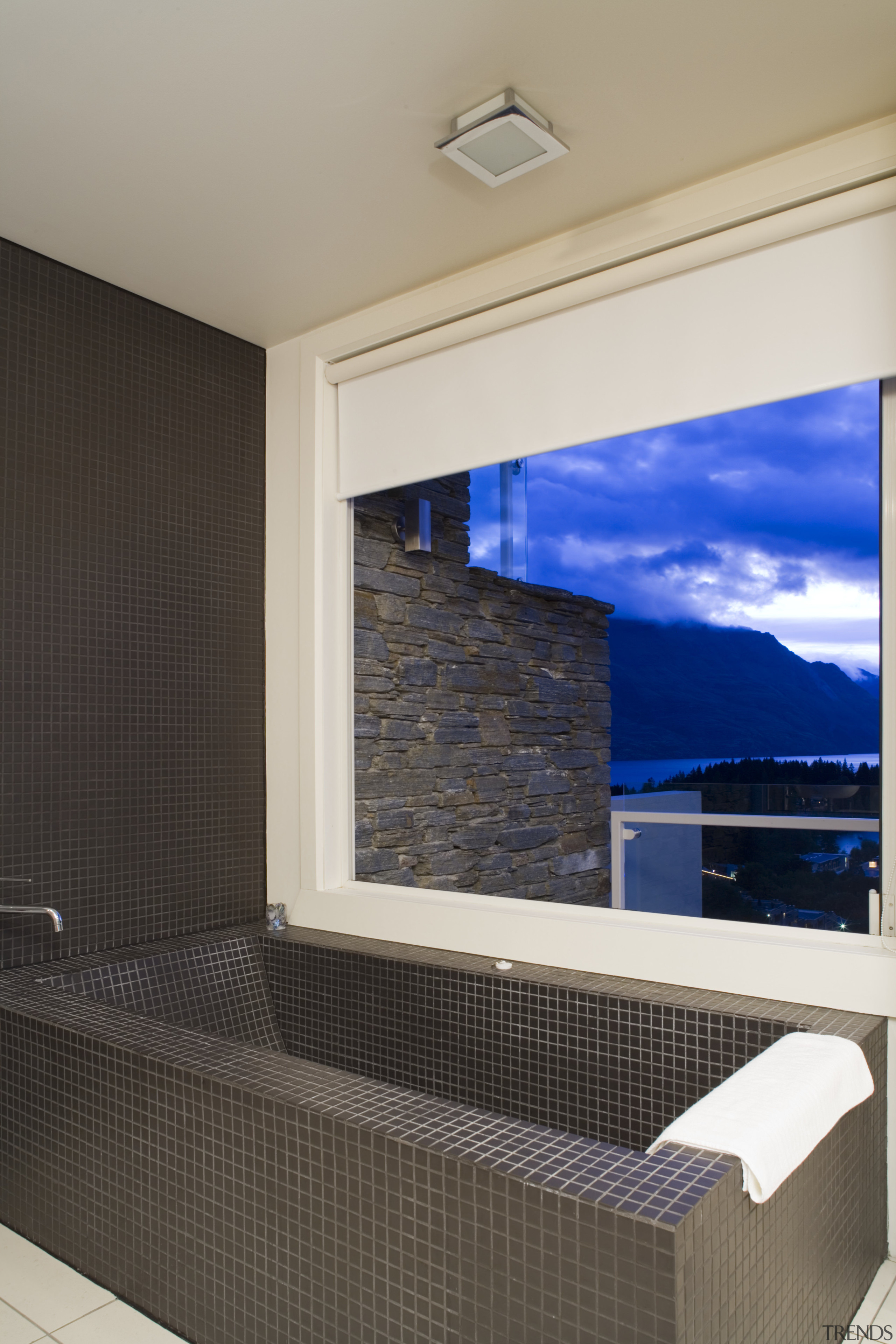 Interior view of ensuite in master bedroom featuring architecture, daylighting, home, house, interior design, real estate, room, wall, window, gray, black