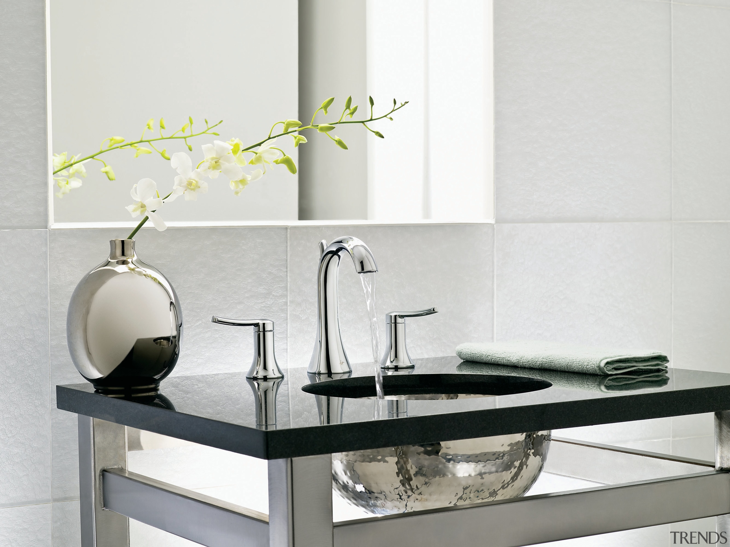 View of a basin and faucets by Moen. ceramic, coffee table, furniture, interior design, product design, table, tap, white