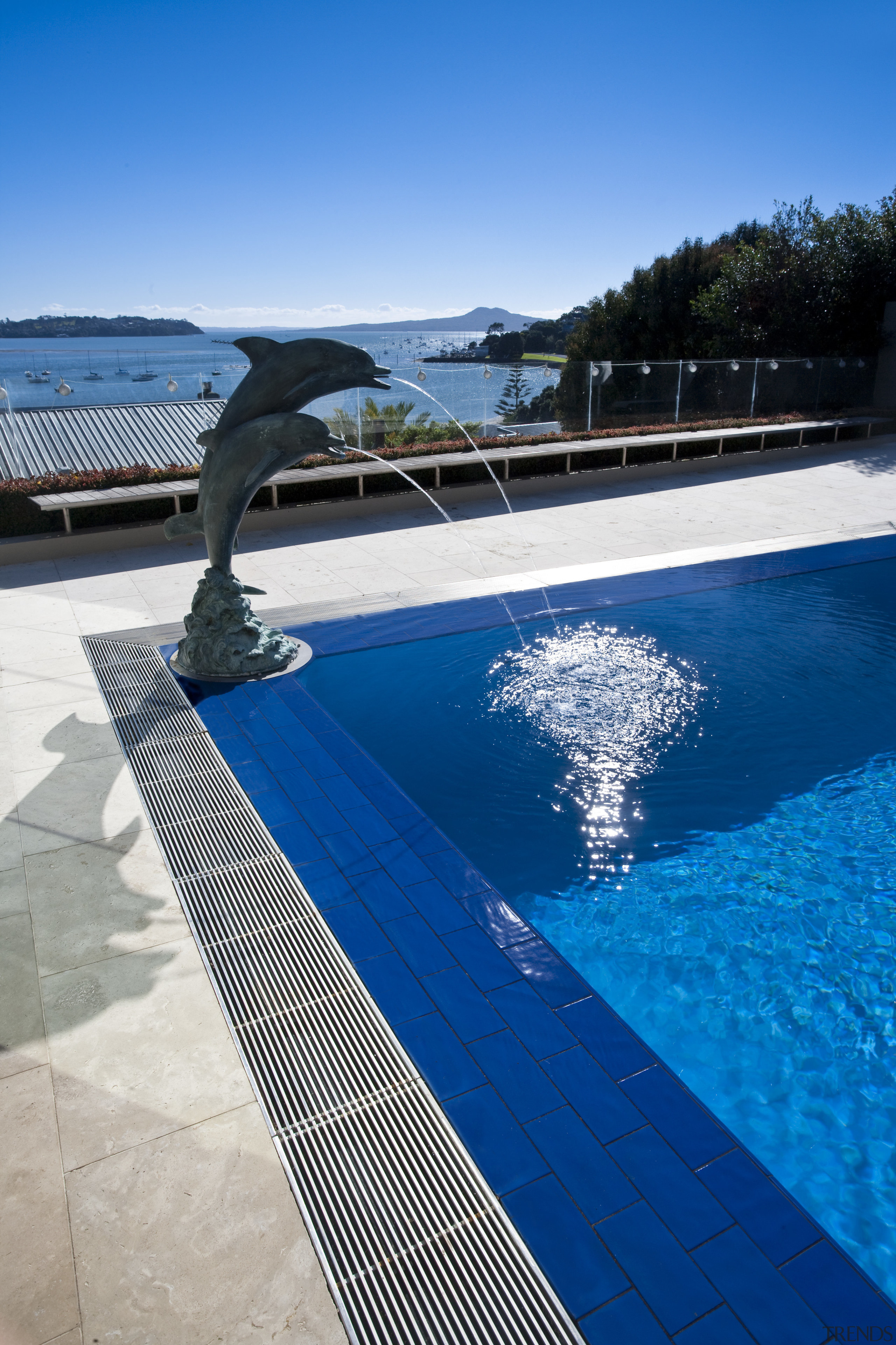 Exterior view of contemporary outdoor pool area, focus blue, cloud, leisure, reflection, roof, sky, swimming pool, vacation, water, blue