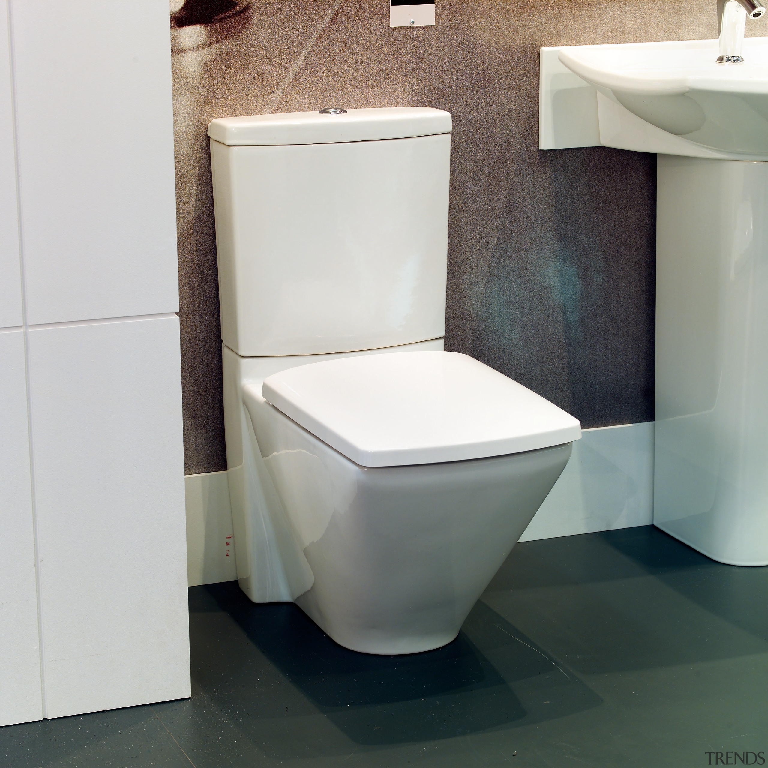 A detail of a toilet - A detail bathroom, bathroom sink, ceramic, floor, plumbing fixture, product, product design, toilet, toilet seat, gray, white