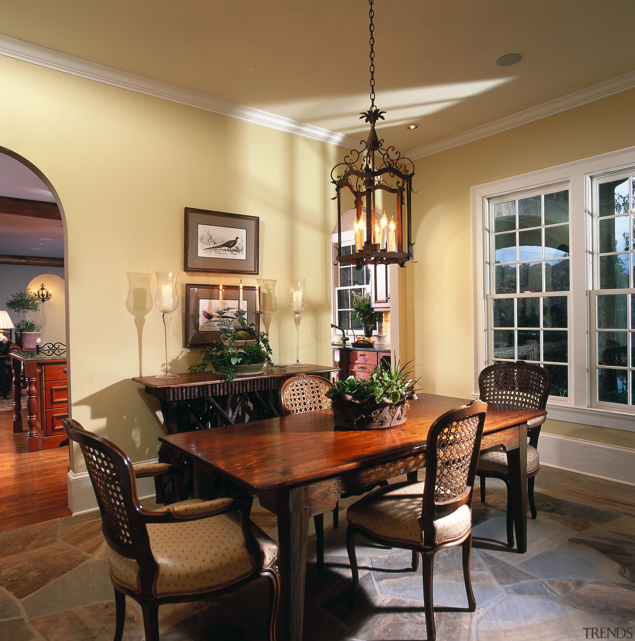 A view of the dining room. - A ceiling, dining room, furniture, hardwood, home, interior design, living room, room, table, window, brown