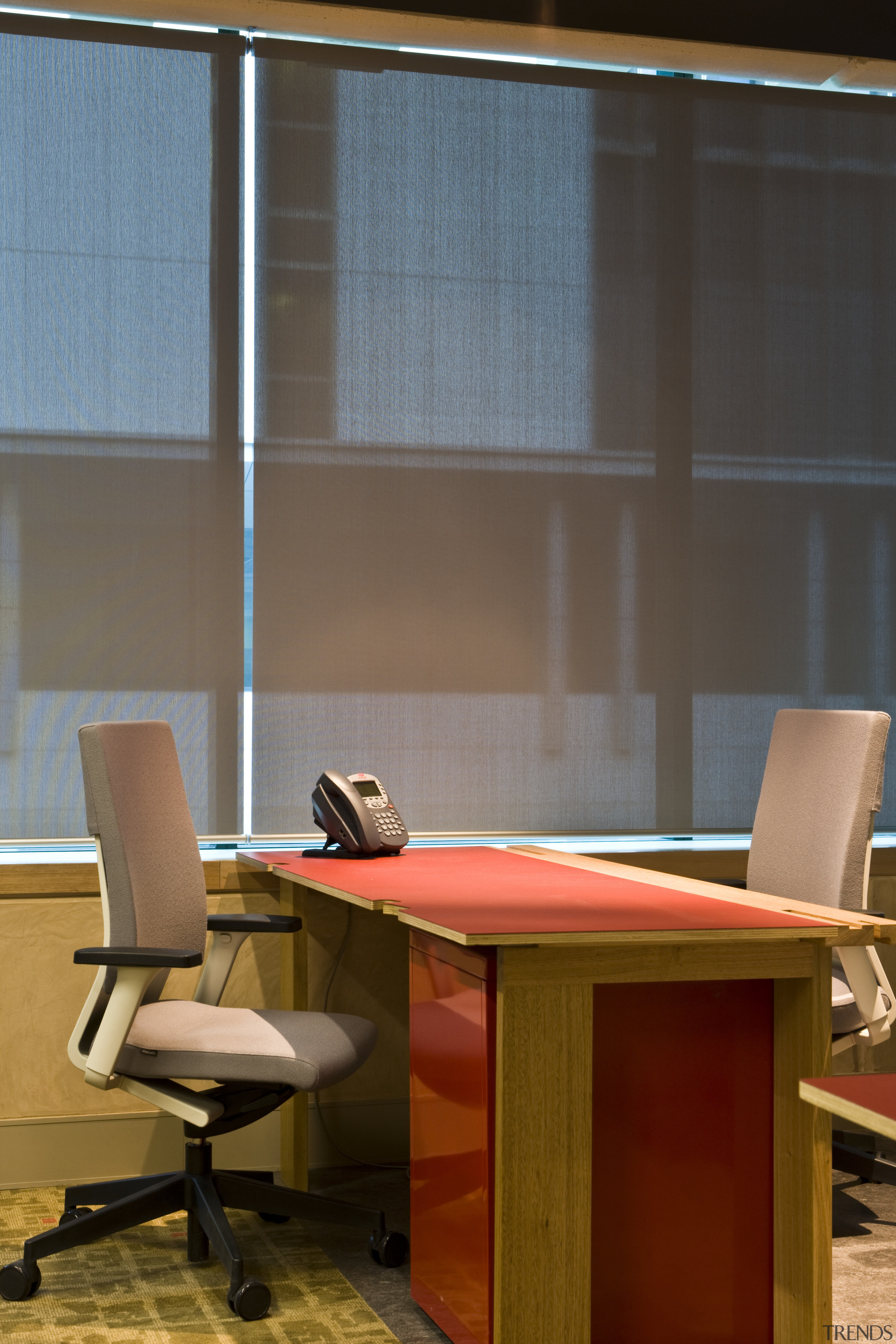 Interior view of the Trinity Group's offices which chair, desk, furniture, interior design, office, table, wood, brown