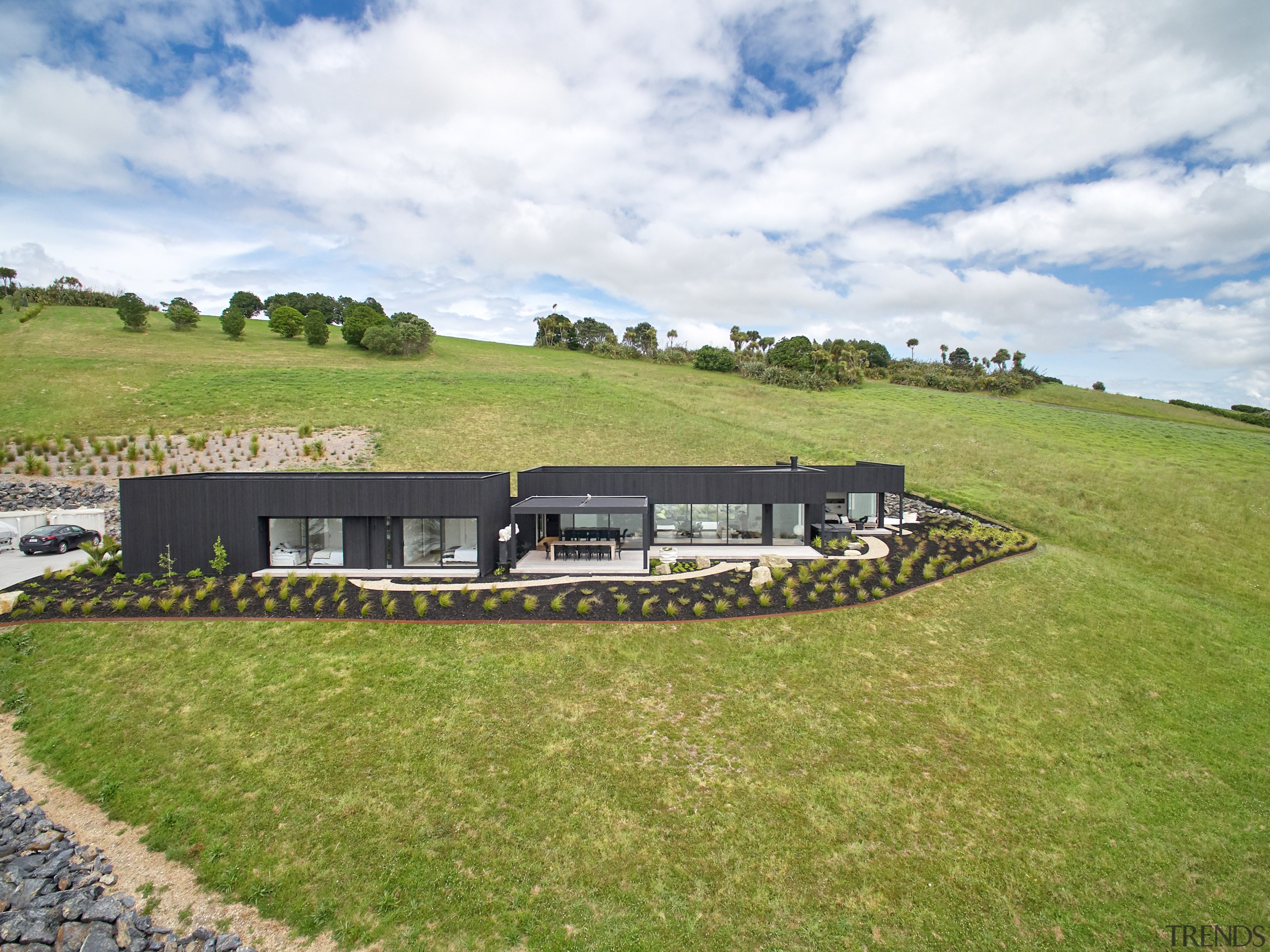 ​​​​​​​Seen from a distance, this home’s slender footprint 