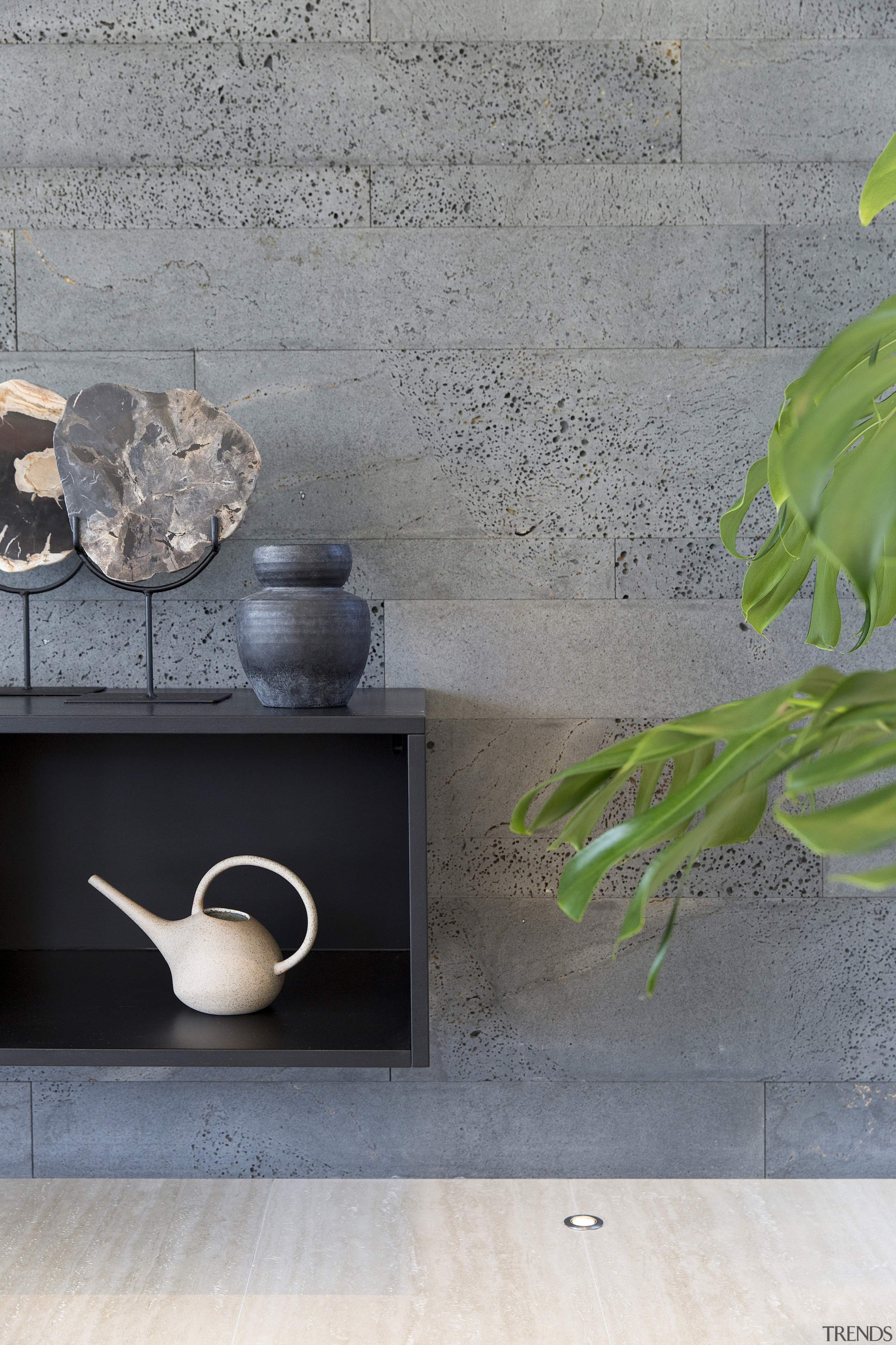 Black fixtures and cabinetry form a contrast to 