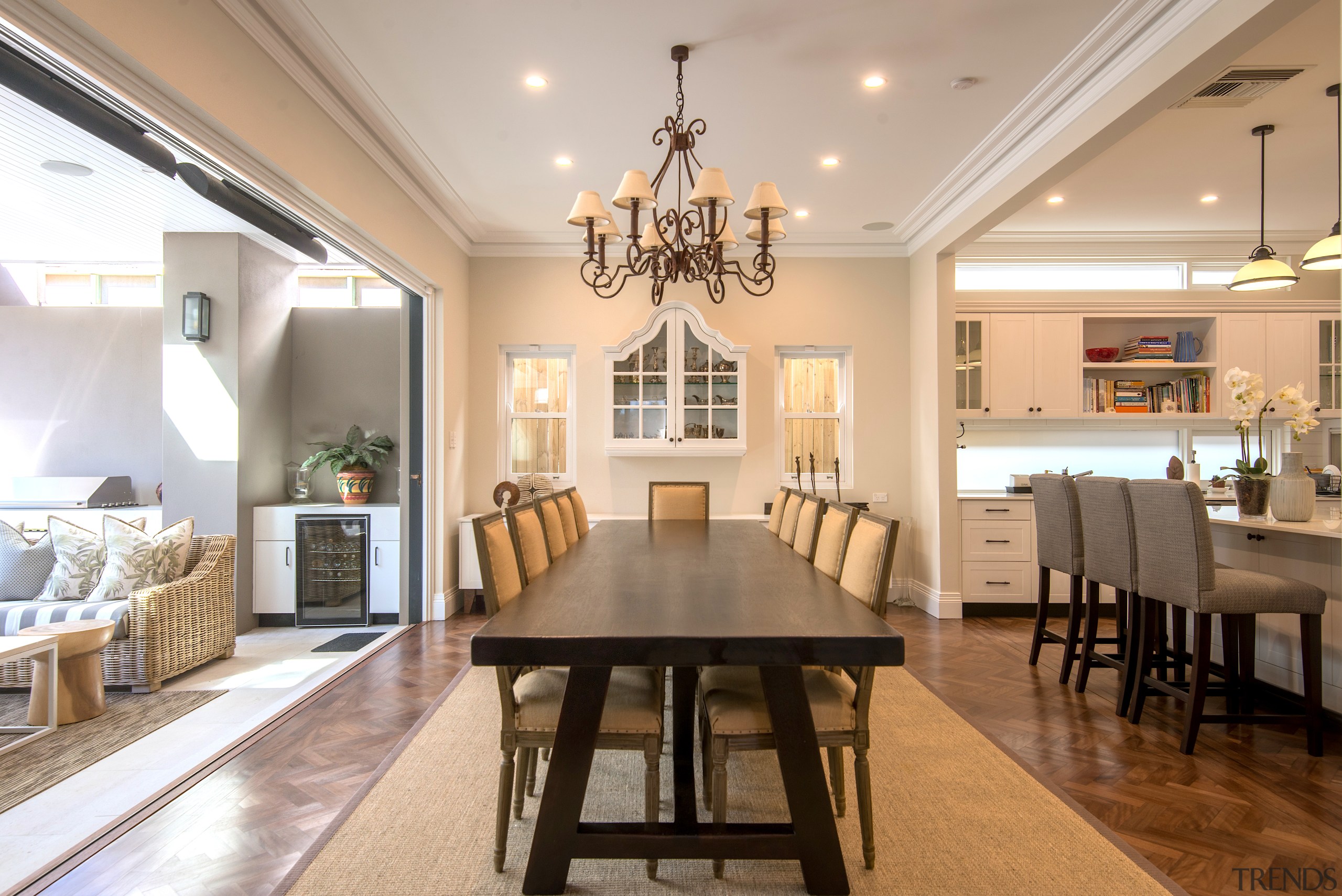 For this Michael Folk renovation, the new dining architecture, building, ceiling, chandelier, dining room, estate, floor, flooring, furniture, hardwood, home, house, interior design, lighting, living room, property, real estate, room, table, wood flooring, gray, brown