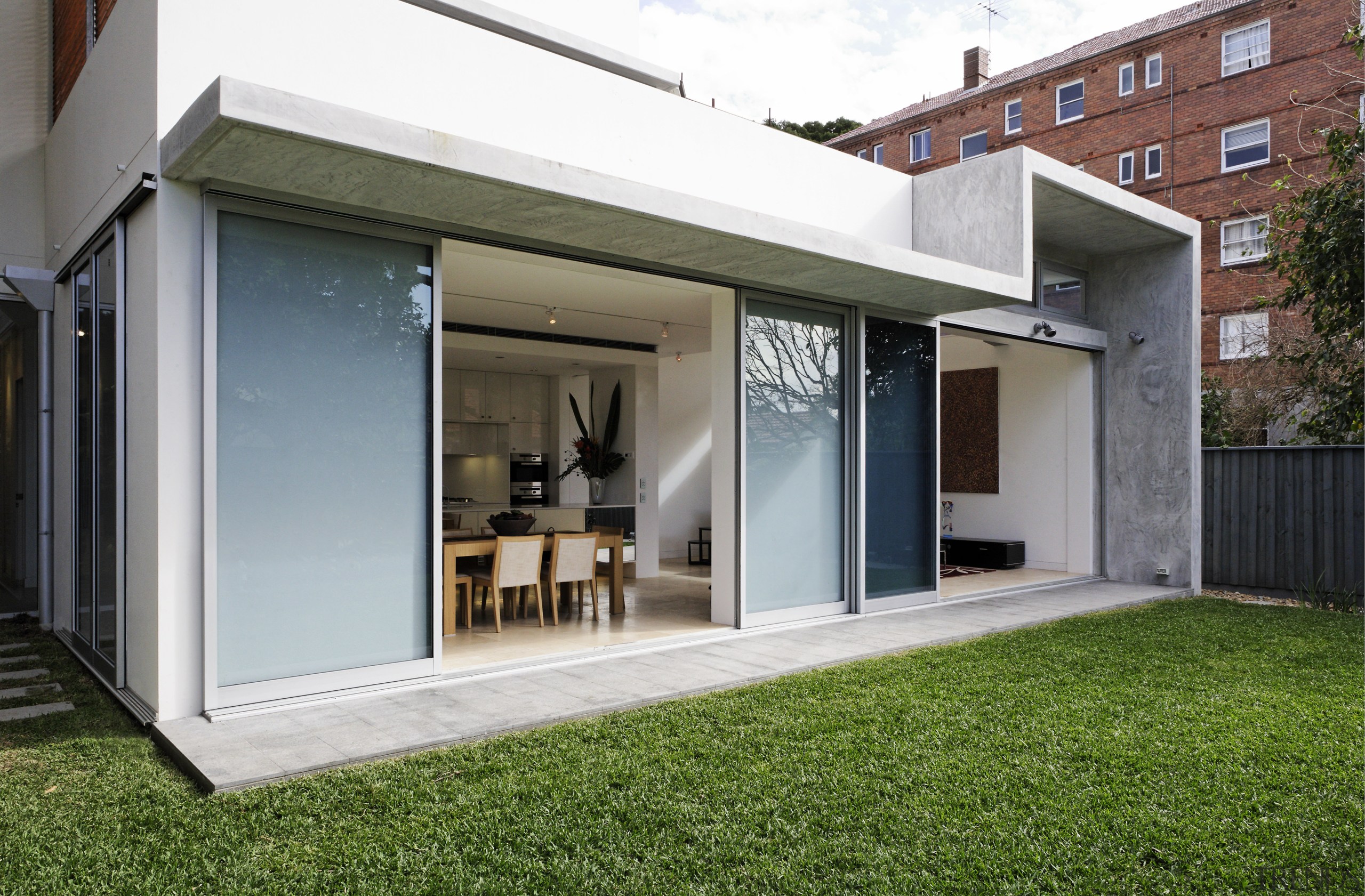 Exterior view of a three unit development designed architecture, door, facade, home, house, orangery, property, real estate, window, gray