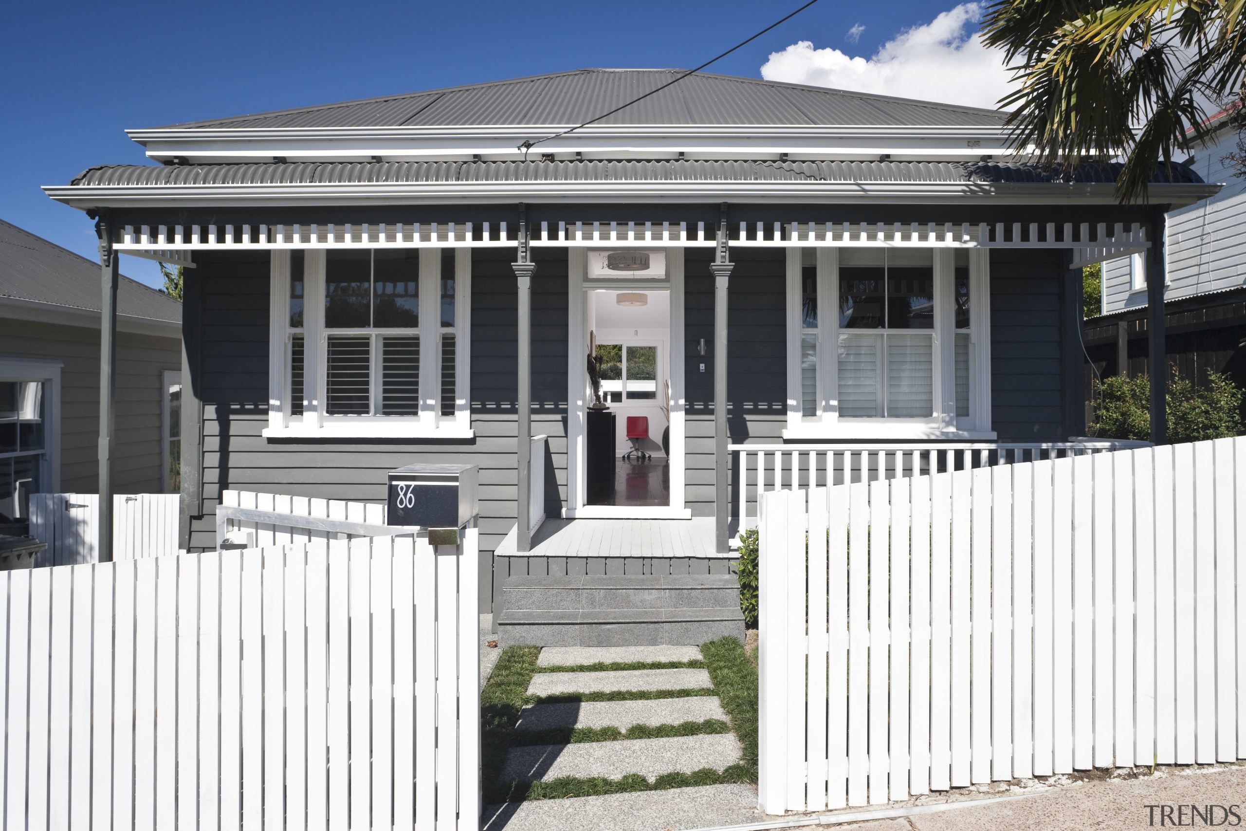 View of this modern home - View of building, estate, facade, fence, home, house, neighbourhood, picket fence, property, real estate, residential area, white