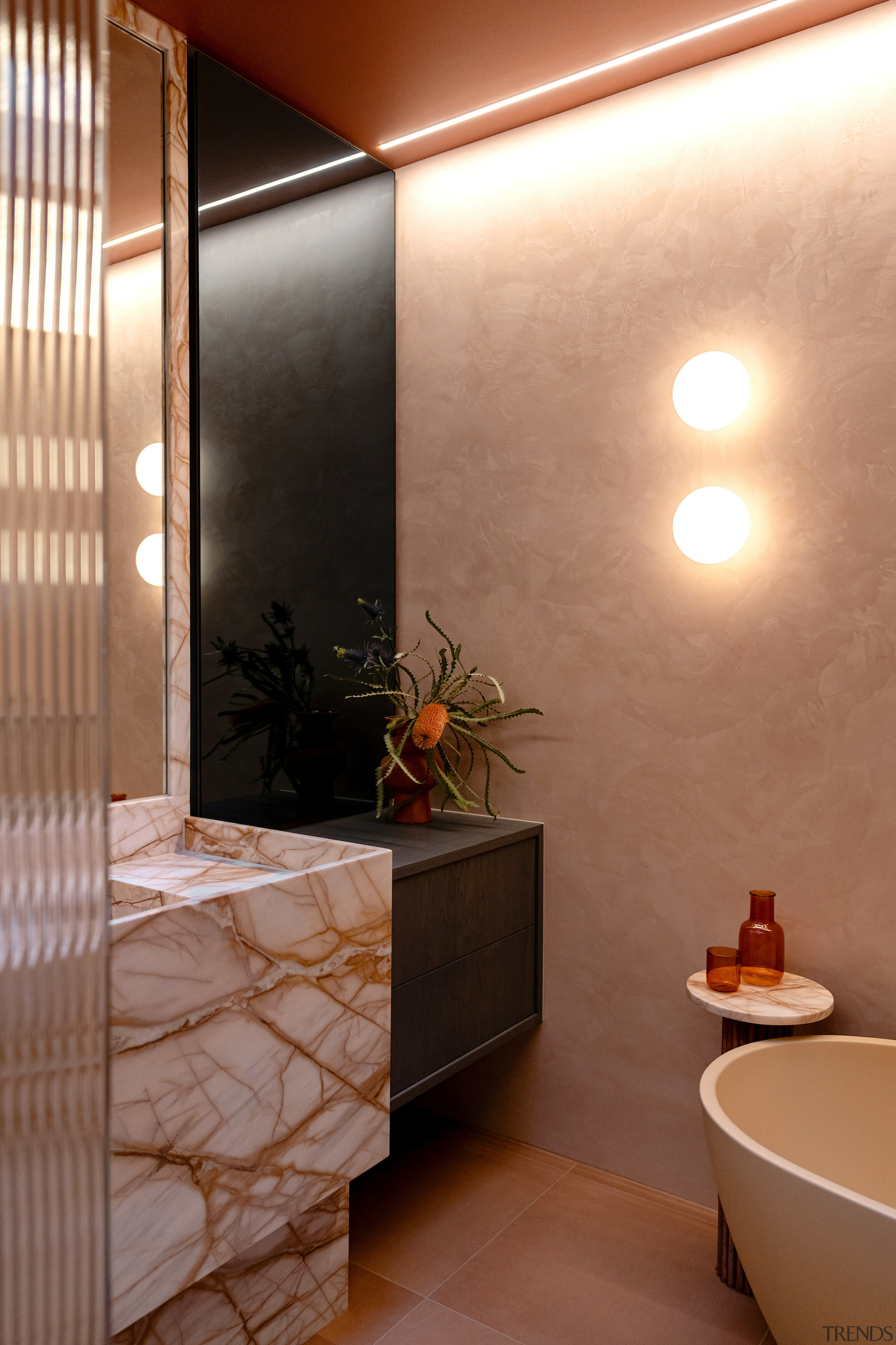 Globe-shaped sconces contribute to the ethereal ambience that 