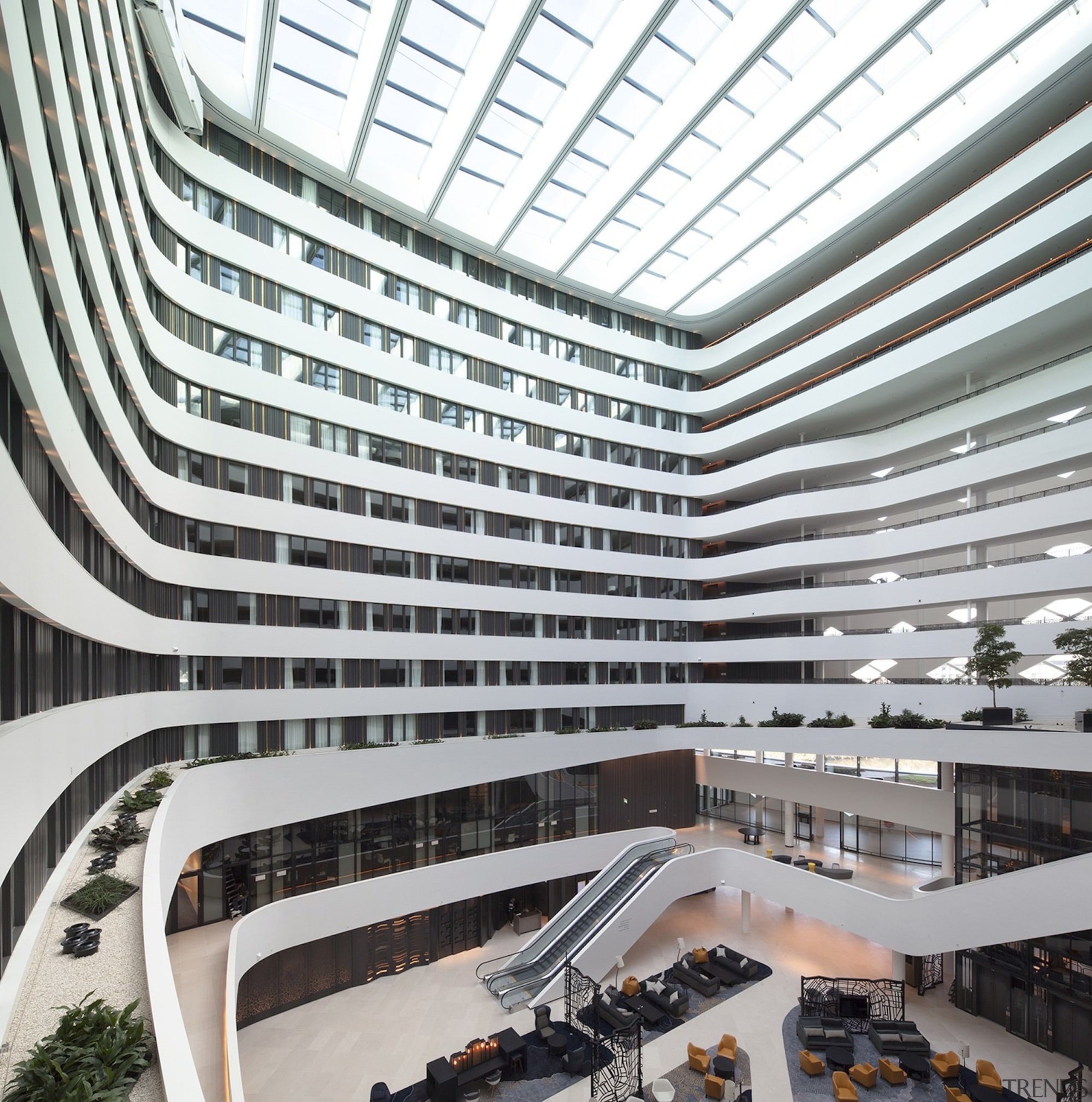 The lobby features a seriously impressive skylight architecture, building, commercial building, corporate headquarters, daylighting, headquarters, metropolis, metropolitan area, mixed use, shopping mall, white, gray