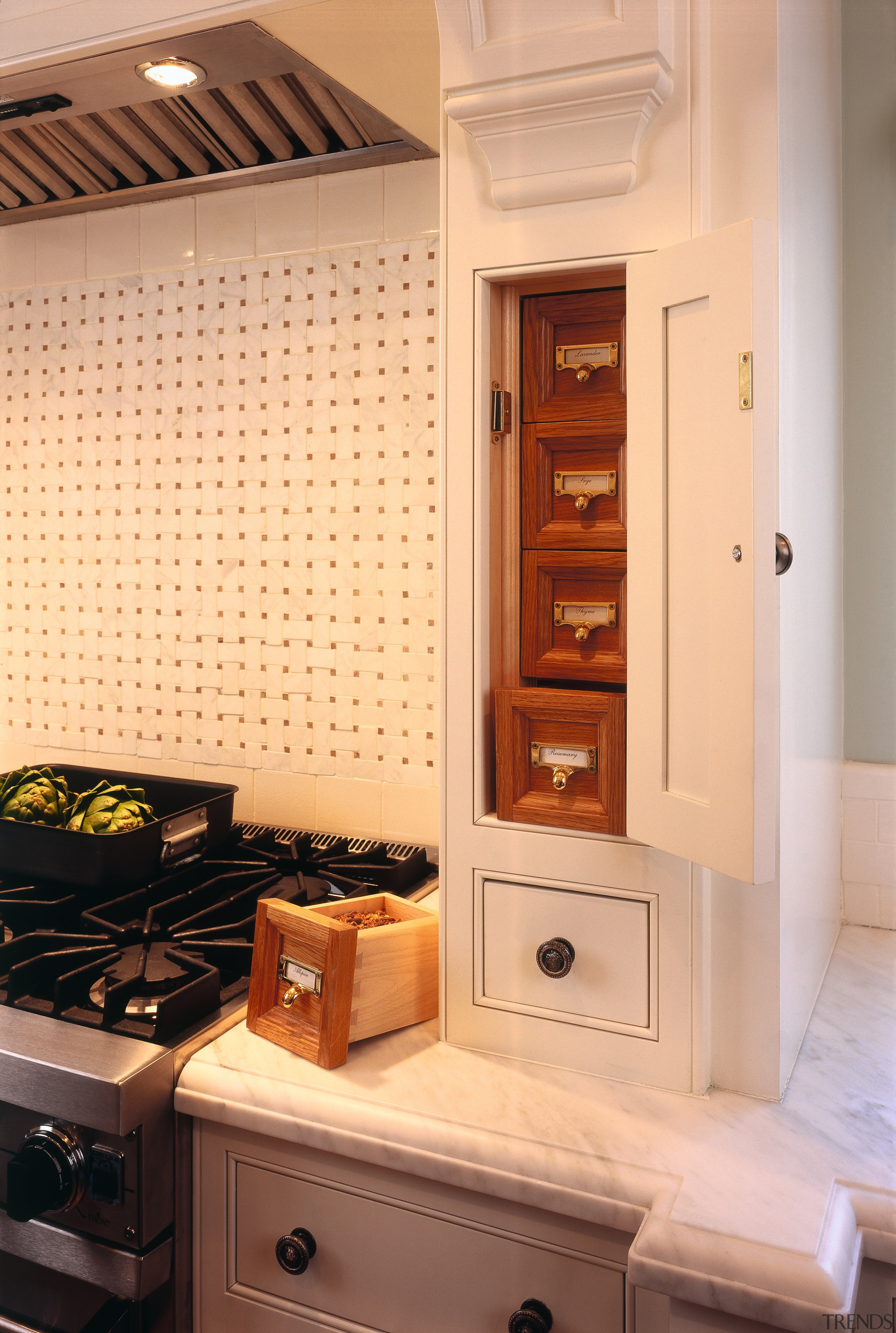 Kitchen with white traditional style cabinetry, spice drawers, cabinetry, countertop, furniture, home appliance, interior design, kitchen, major appliance, room, orange