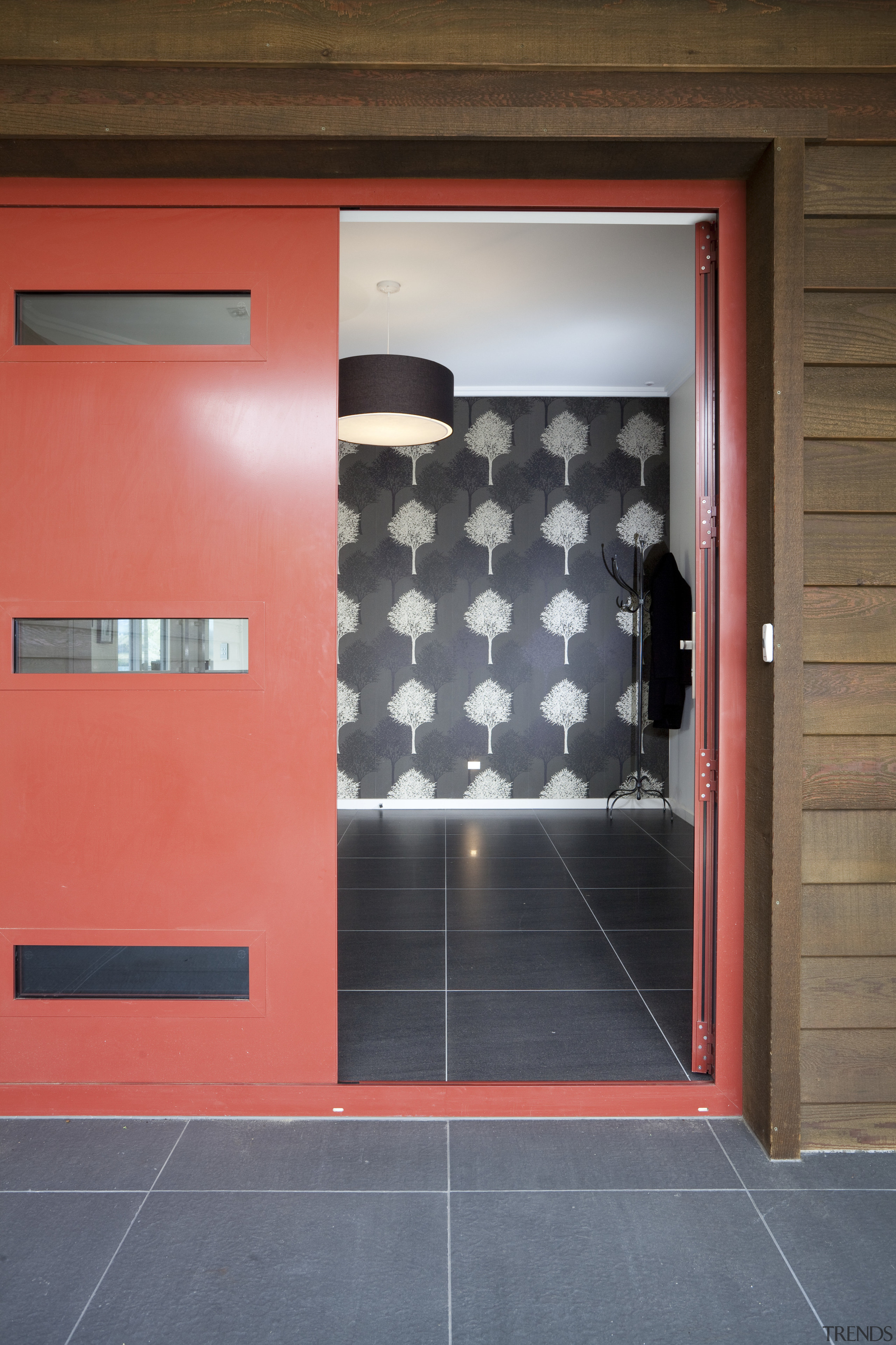 The flooring for this Otago home was chosen architecture, door, floor, flooring, interior design, wall, gray, red, brown