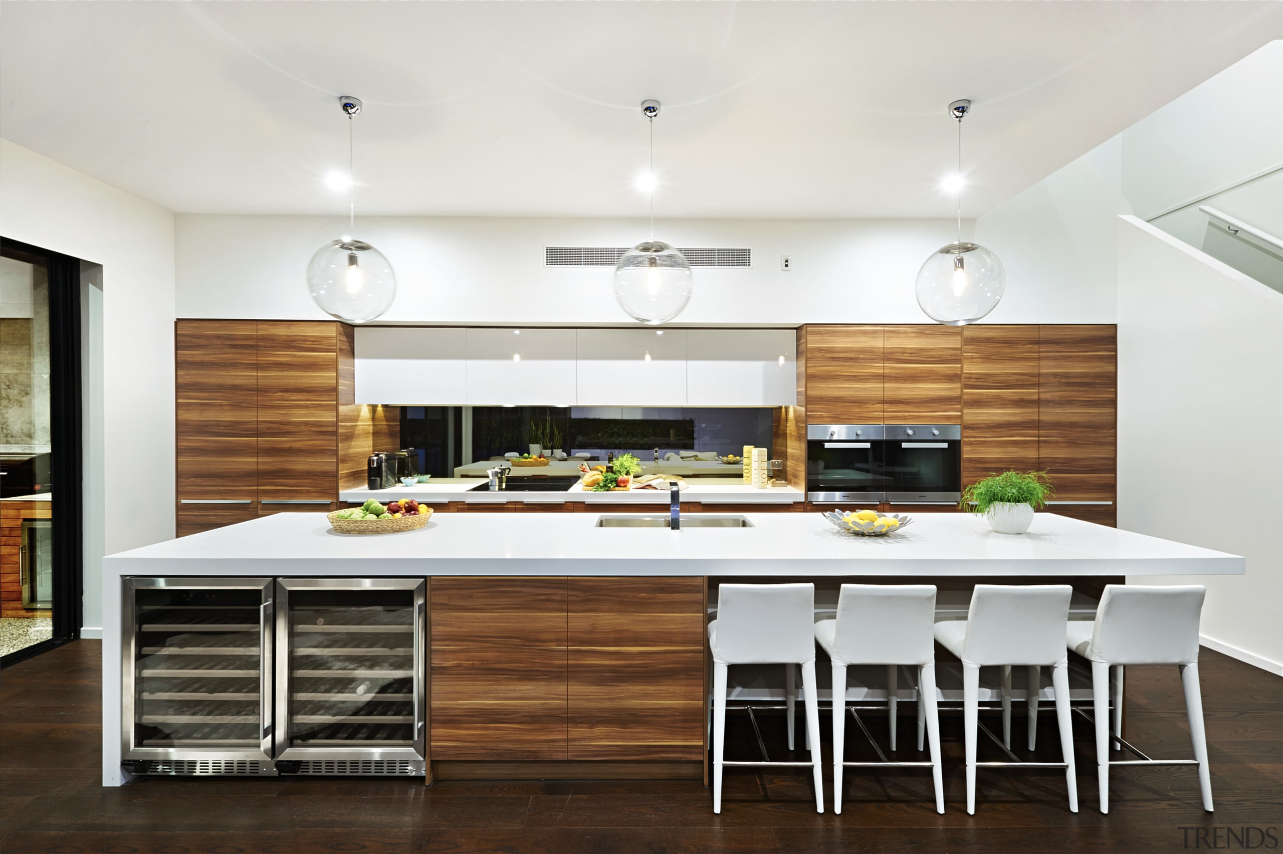 White benchtops and woodgrain laminate feature in this countertop, cuisine classique, floor, interior design, kitchen, real estate, white