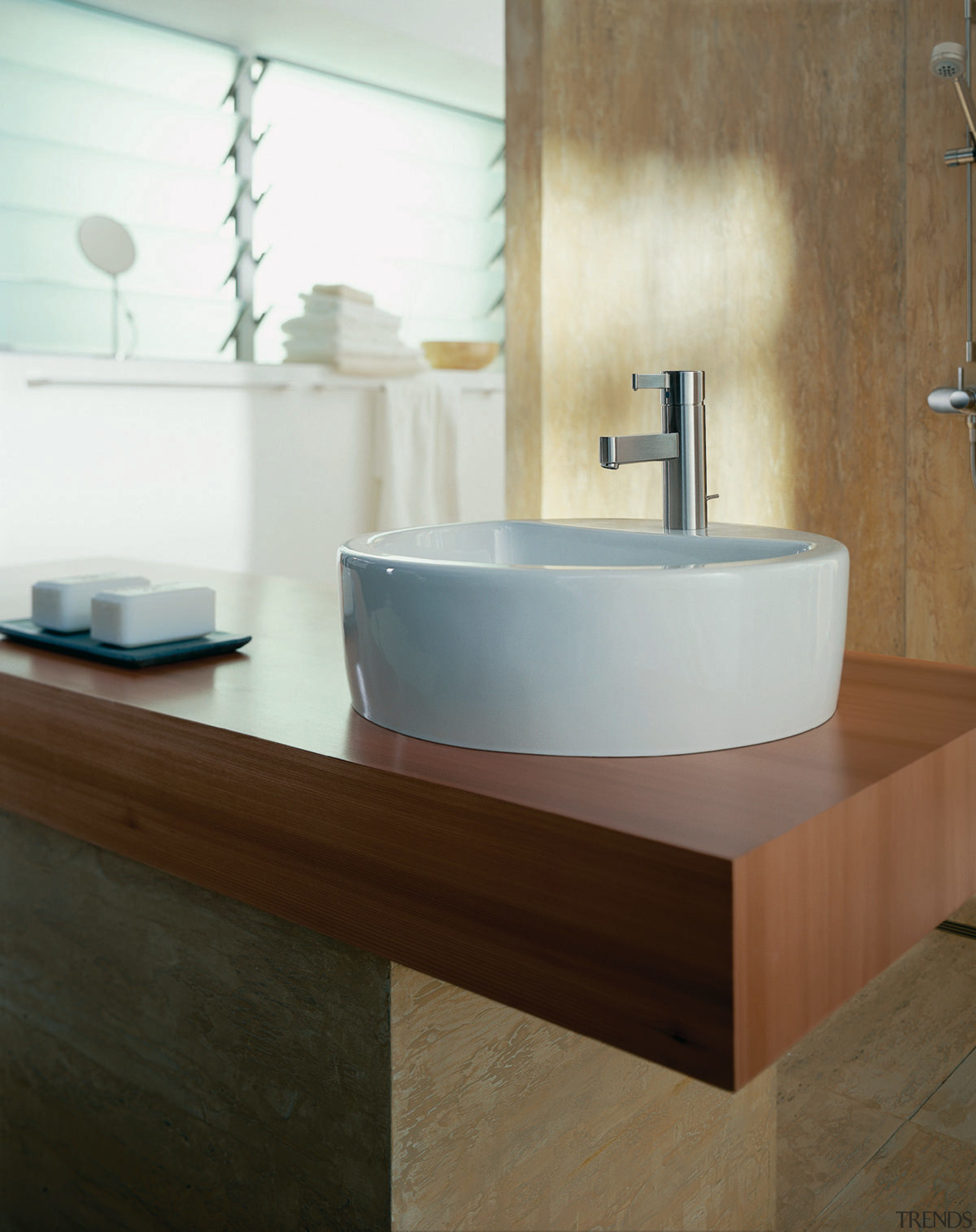 A view of a bathroom, wooden vanity top, bathroom, bathroom accessory, bathroom cabinet, bathroom sink, bidet, ceramic, floor, interior design, plumbing fixture, product design, sink, tap, tile, wall, brown, white