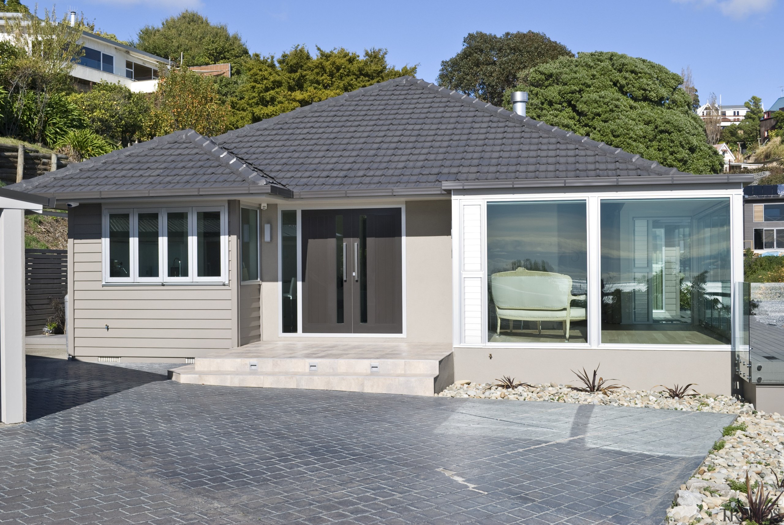 Exterior view of a renovated house which was cottage, elevation, estate, facade, home, house, property, real estate, residential area, siding, window, gray