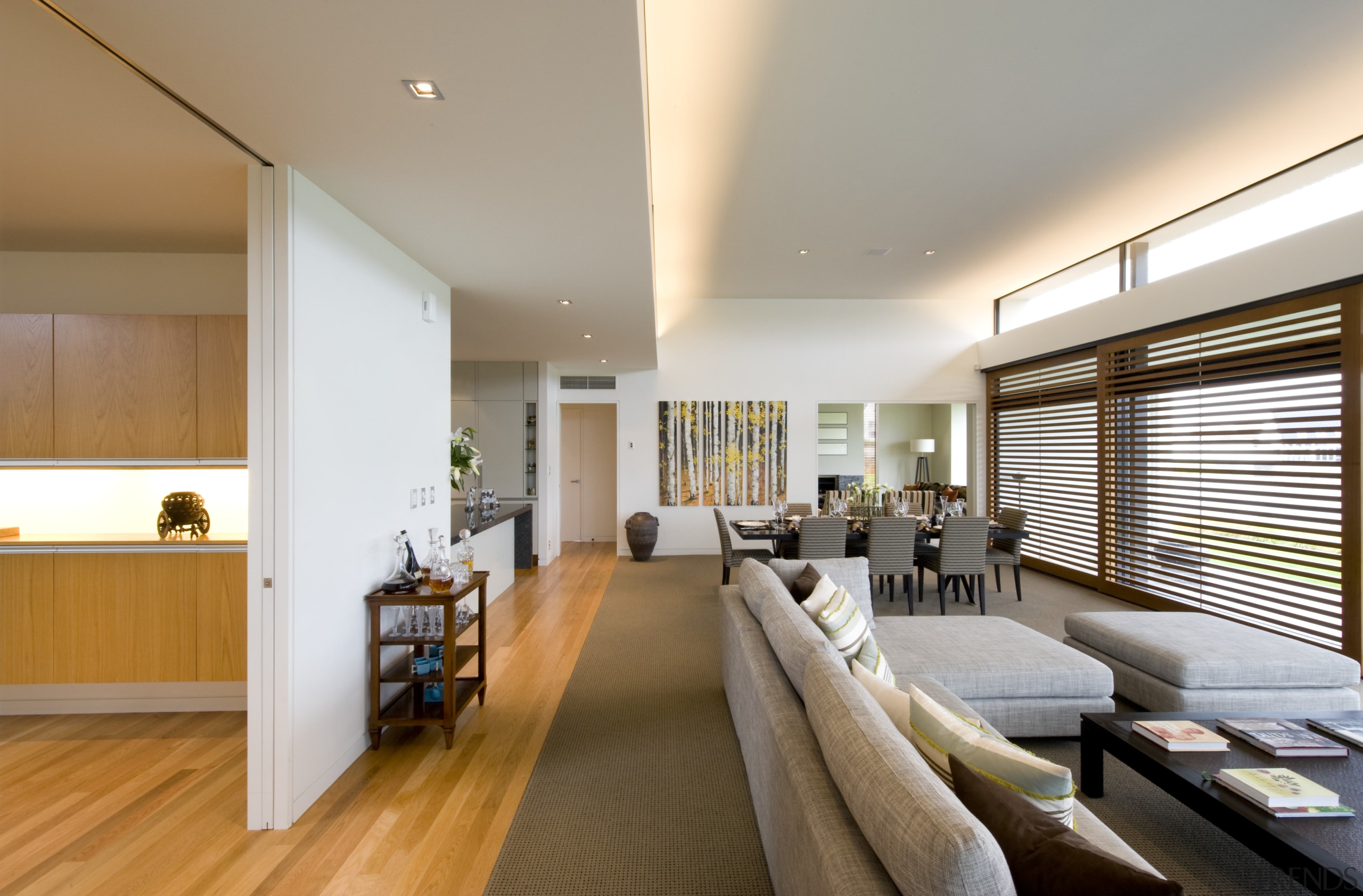 Ceiling heights are raised in the living area, architecture, ceiling, daylighting, floor, flooring, house, interior design, living room, real estate, room, window, gray, brown