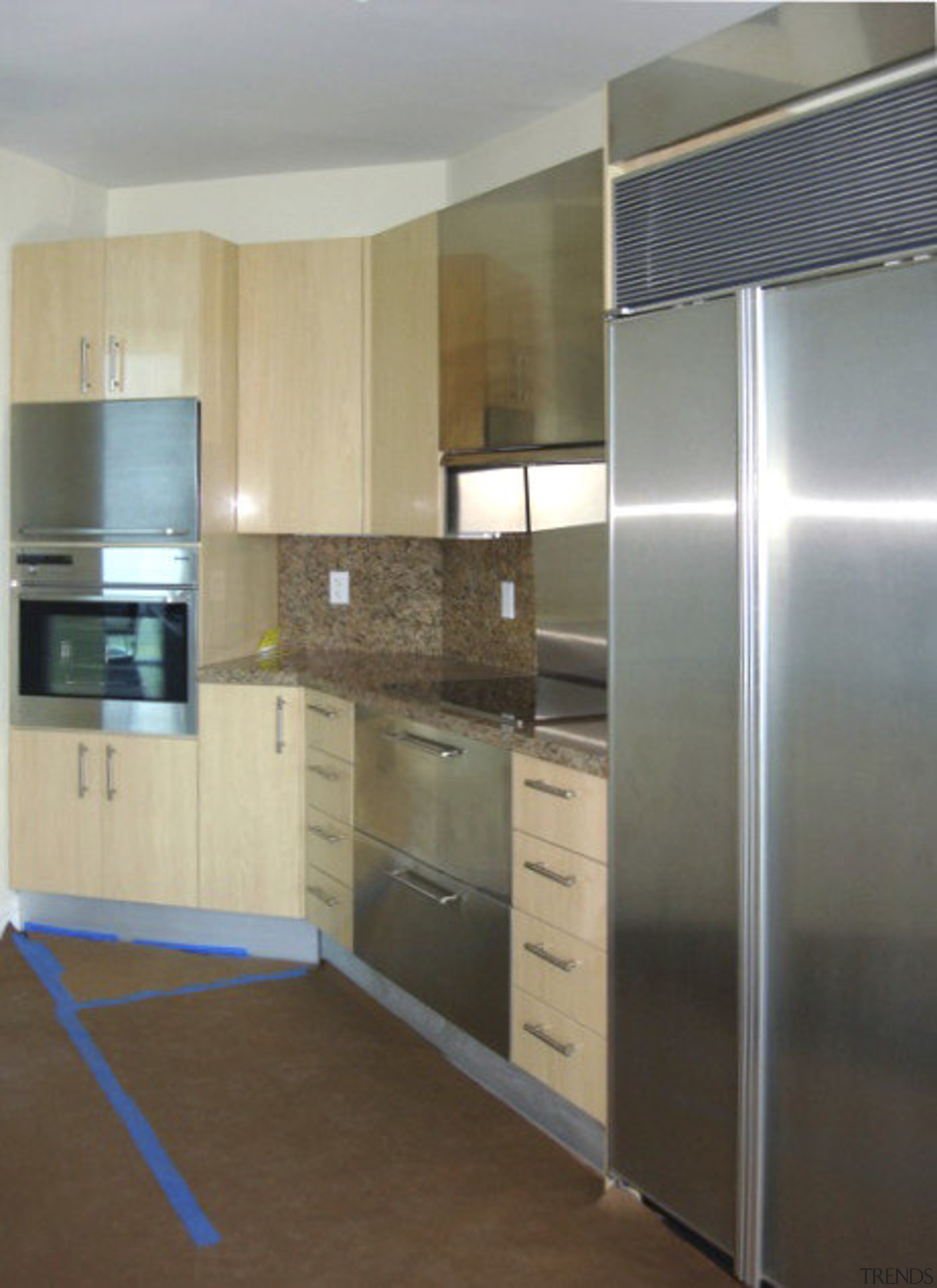 Kitchen view with stainless steel fridge. - Kitchen cabinetry, countertop, floor, flooring, hardwood, home appliance, interior design, kitchen, property, real estate, room, gray