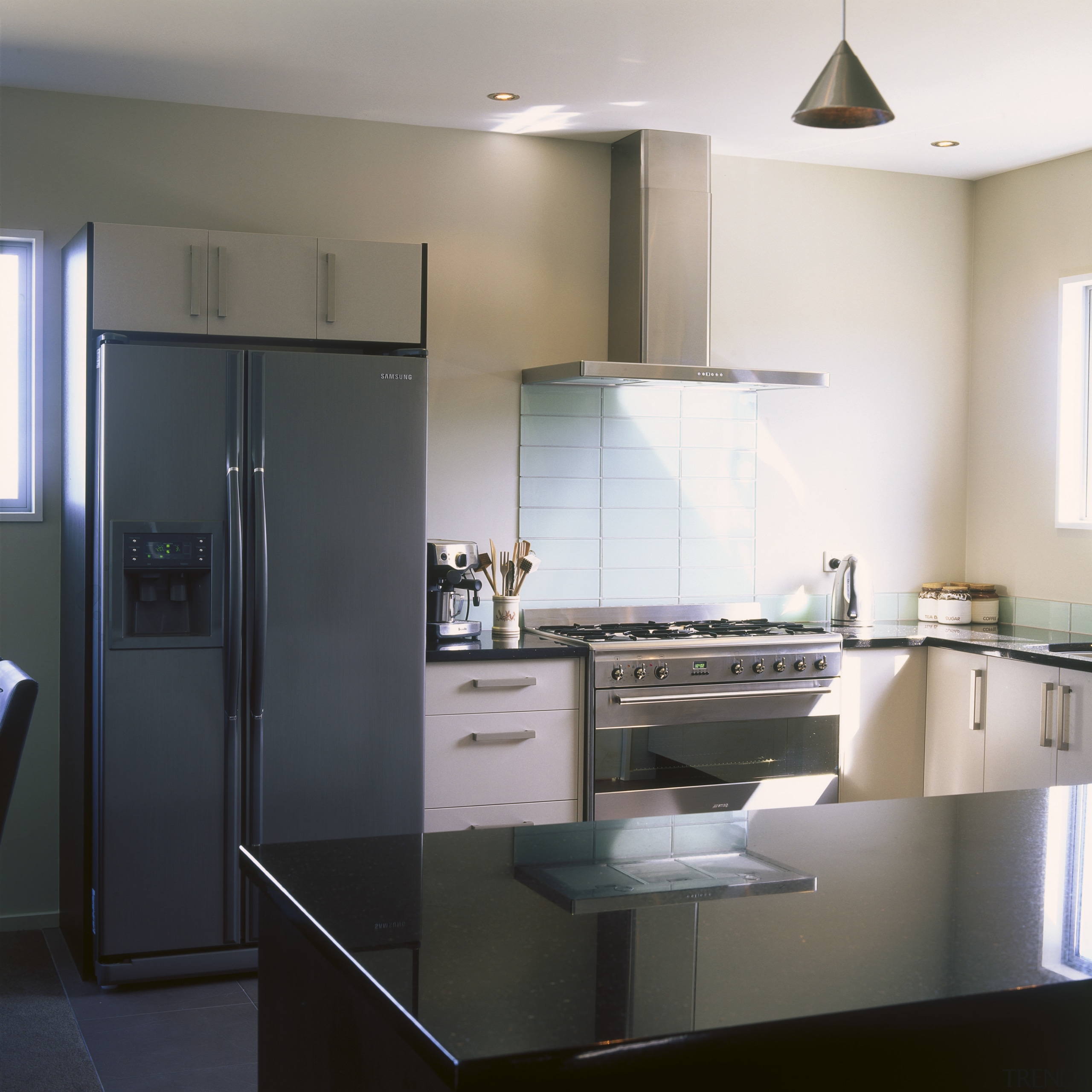 Contemporary kitchen with stainless steel appliances and Corian cabinetry, countertop, cuisine classique, home appliance, interior design, kitchen, room, black, white, gray