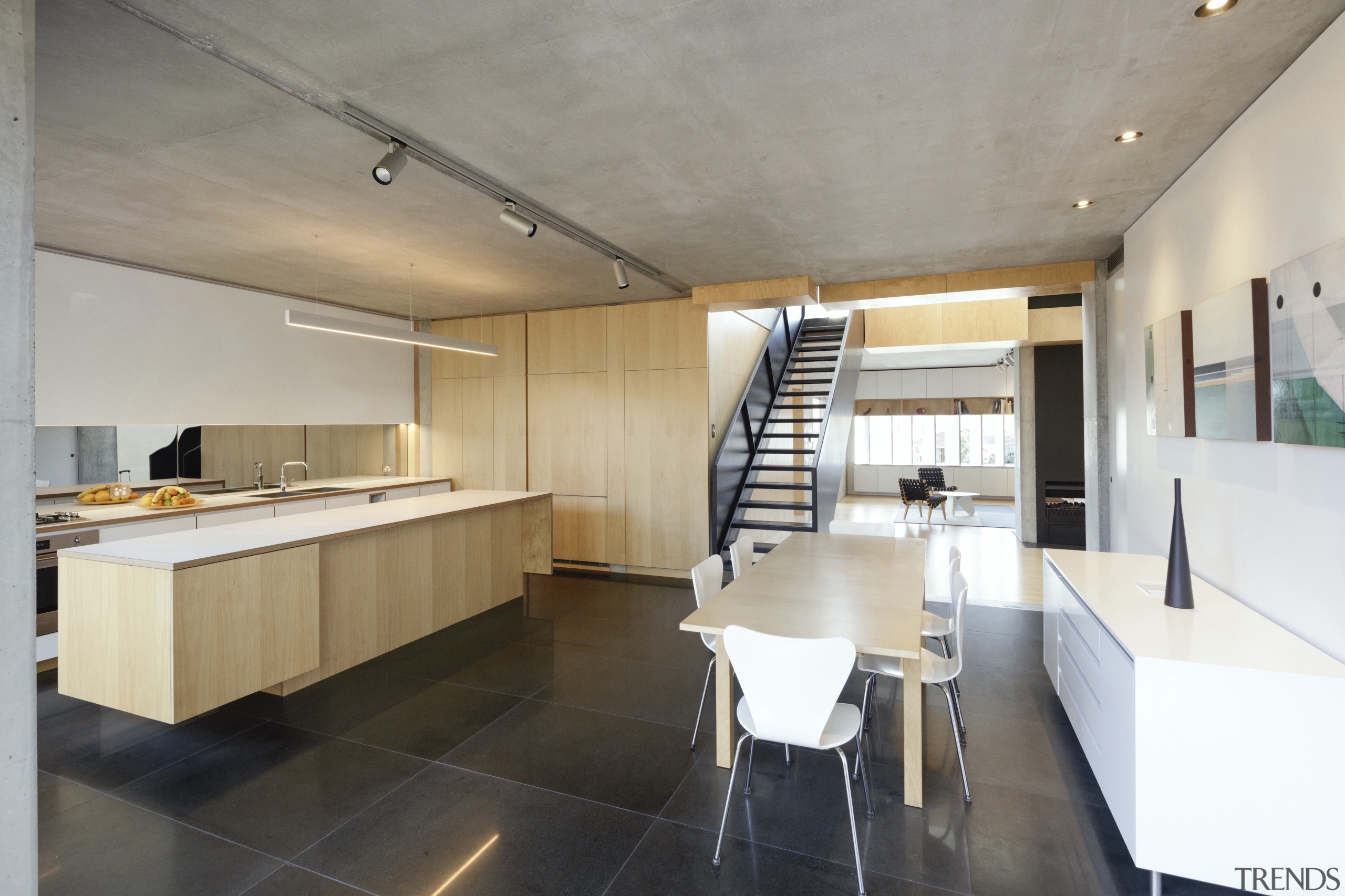 The arrangement and detailing are designed to present apartment, architecture, building, cabinetry, ceiling, countertop, floor, flooring, furniture, home, house, interior design, kitchen, loft, property, real estate, room, table, tile, wall, gray