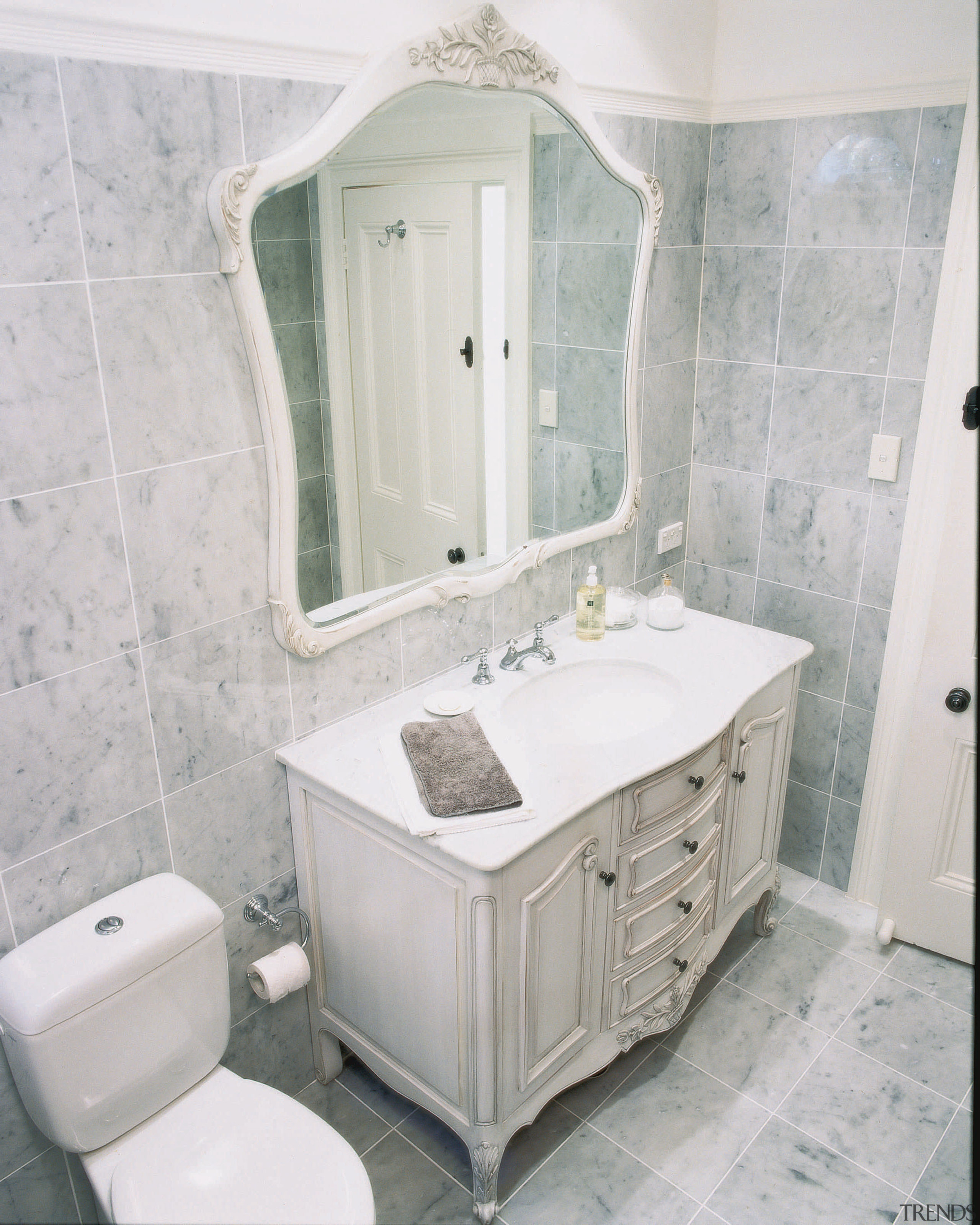 Classical Bathroom with custom vanity &amp; toilet. Marble bathroom, bathroom accessory, bathroom cabinet, floor, home, interior design, plumbing fixture, product, room, sink, tile, gray, white
