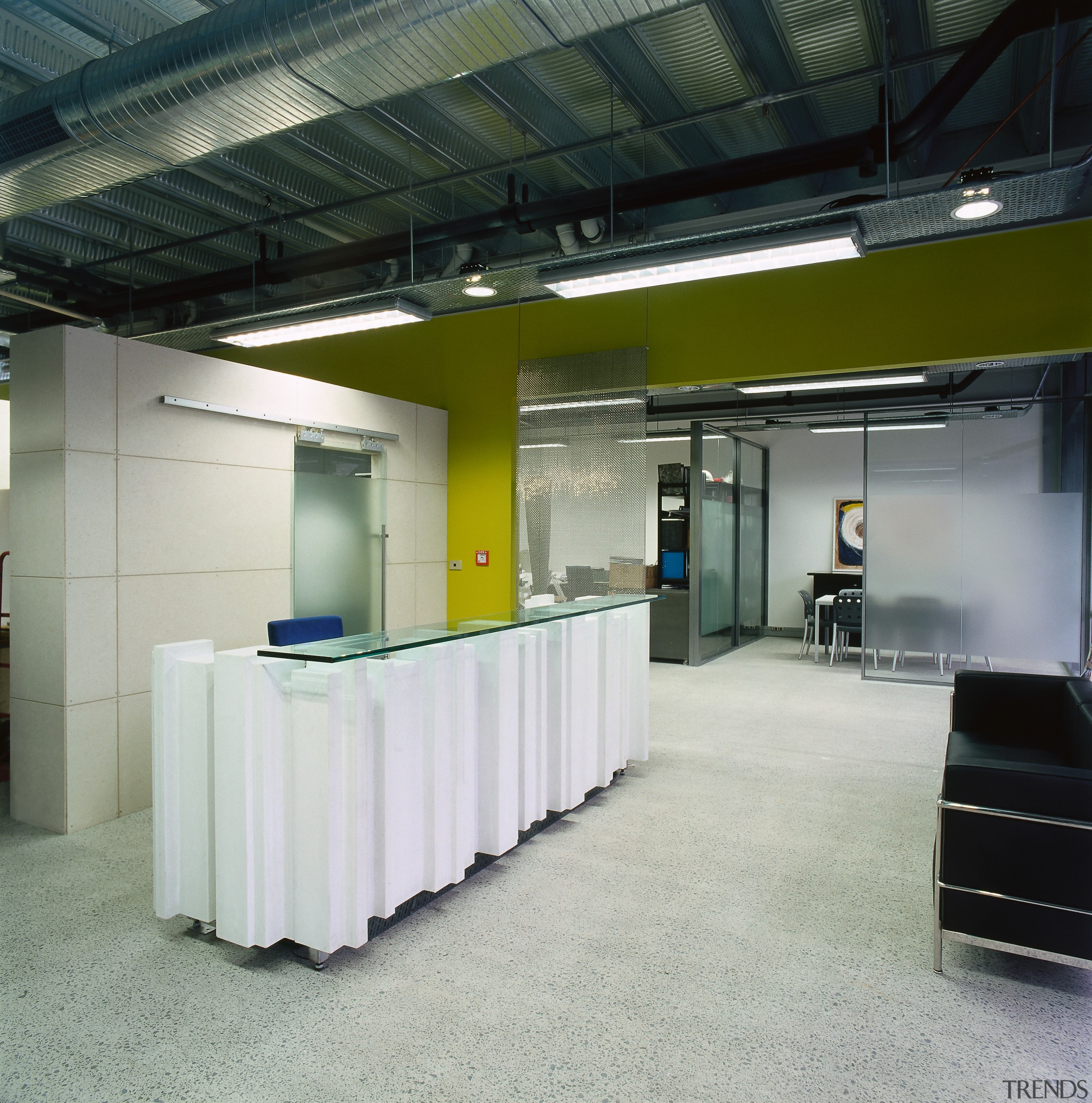 A vie wof the interior of the building. ceiling, floor, office, gray, black