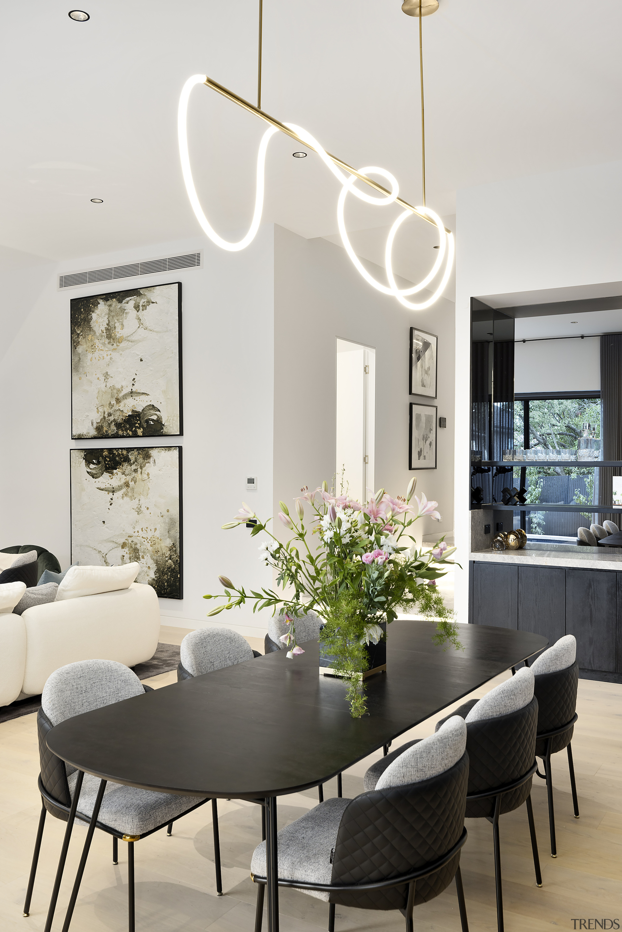 Dining area complete with contemporary pendant. 