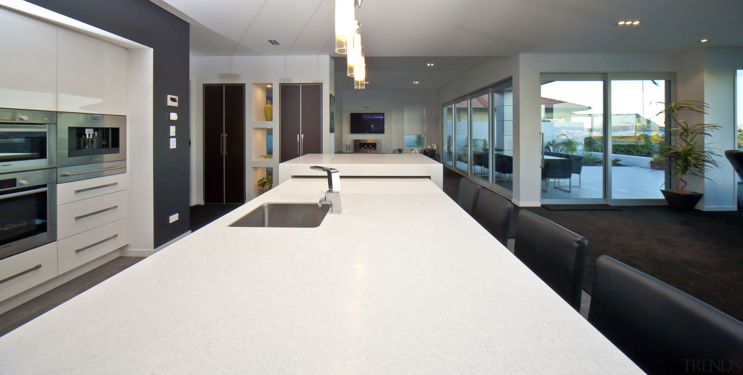 This house was designed and built by Signature countertop, estate, floor, flooring, house, interior design, kitchen, property, real estate, room, white, gray